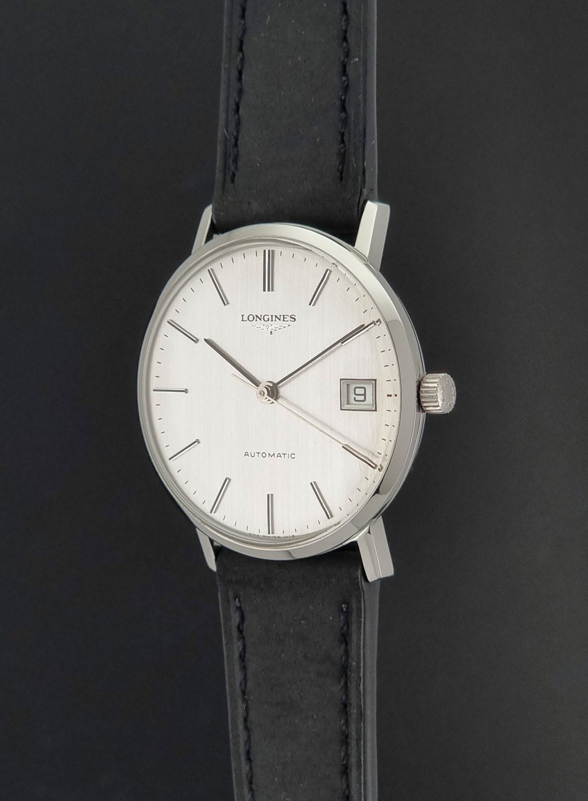 1977 vintage Longines 1118 automatic date watch, close-up showing the crown and adjacent case flank