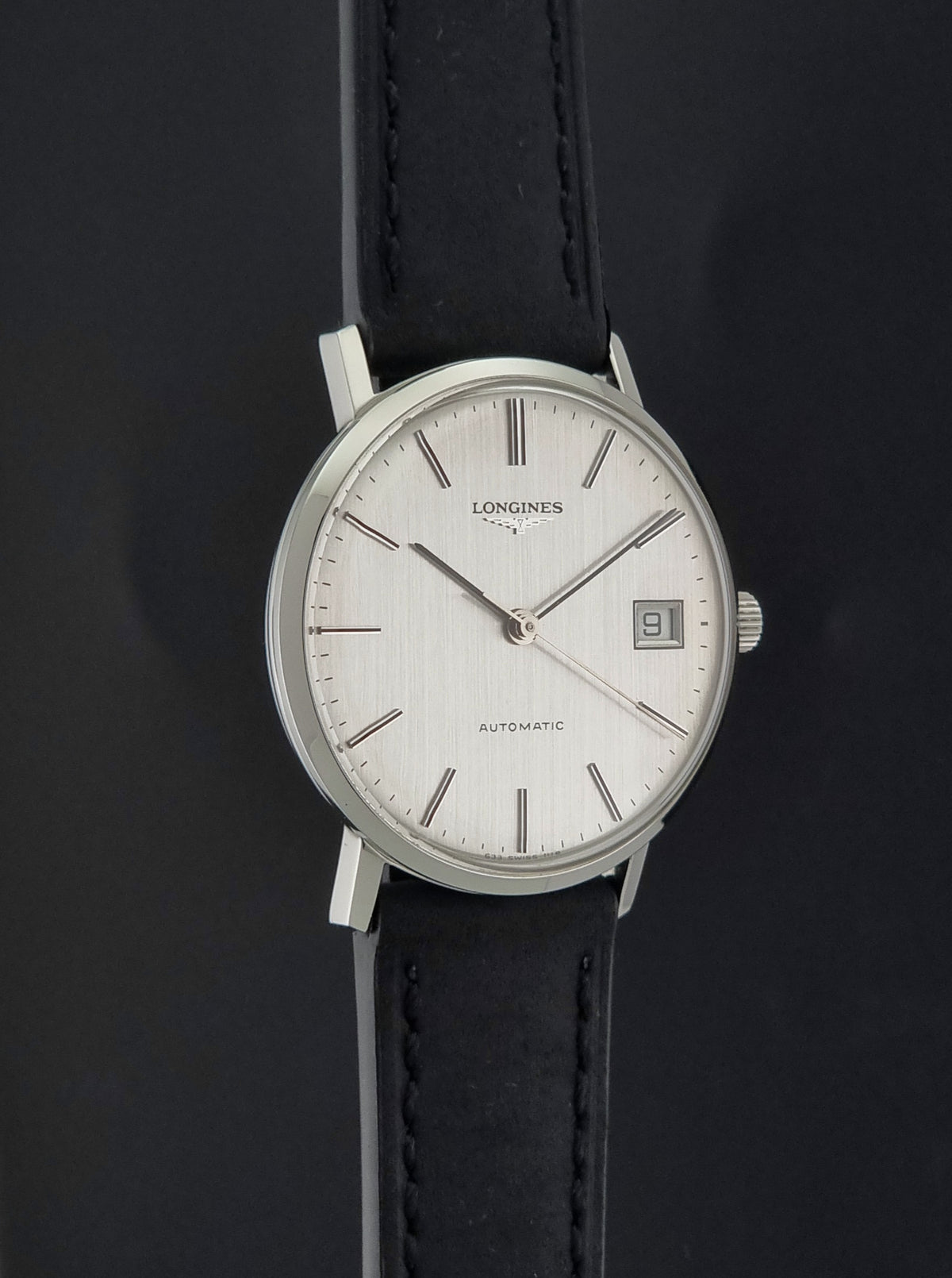 1977 vintage Longines 1118 automatic date watch, opposite side profile showing the case shape and lugs