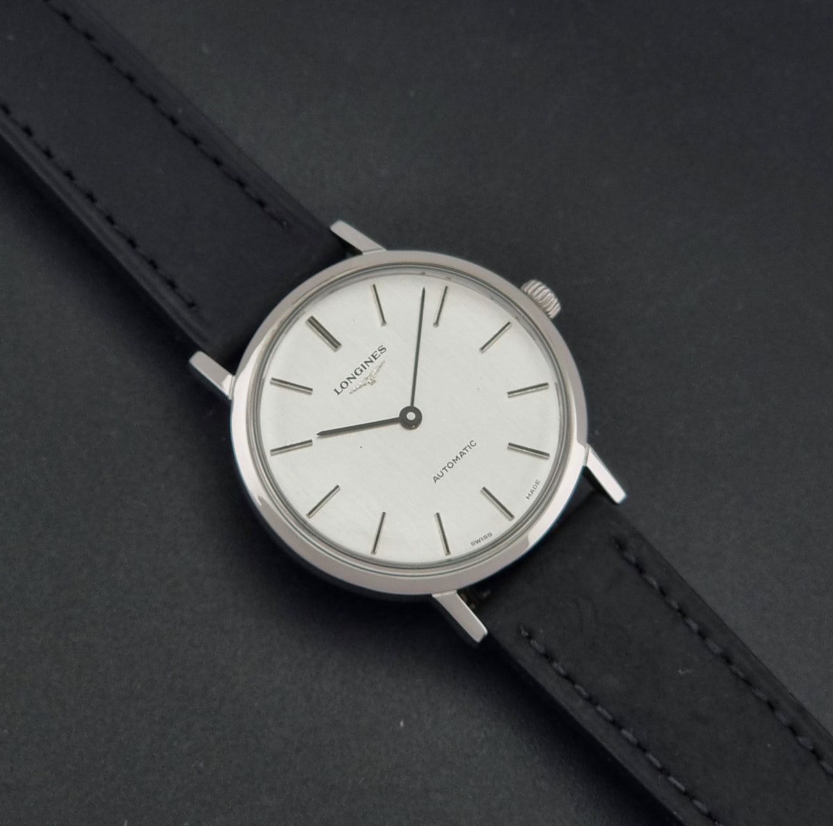 1975 vintage Longines 3029-1 automatic watch, front view featuring the vertically brushed silver two-hand dial