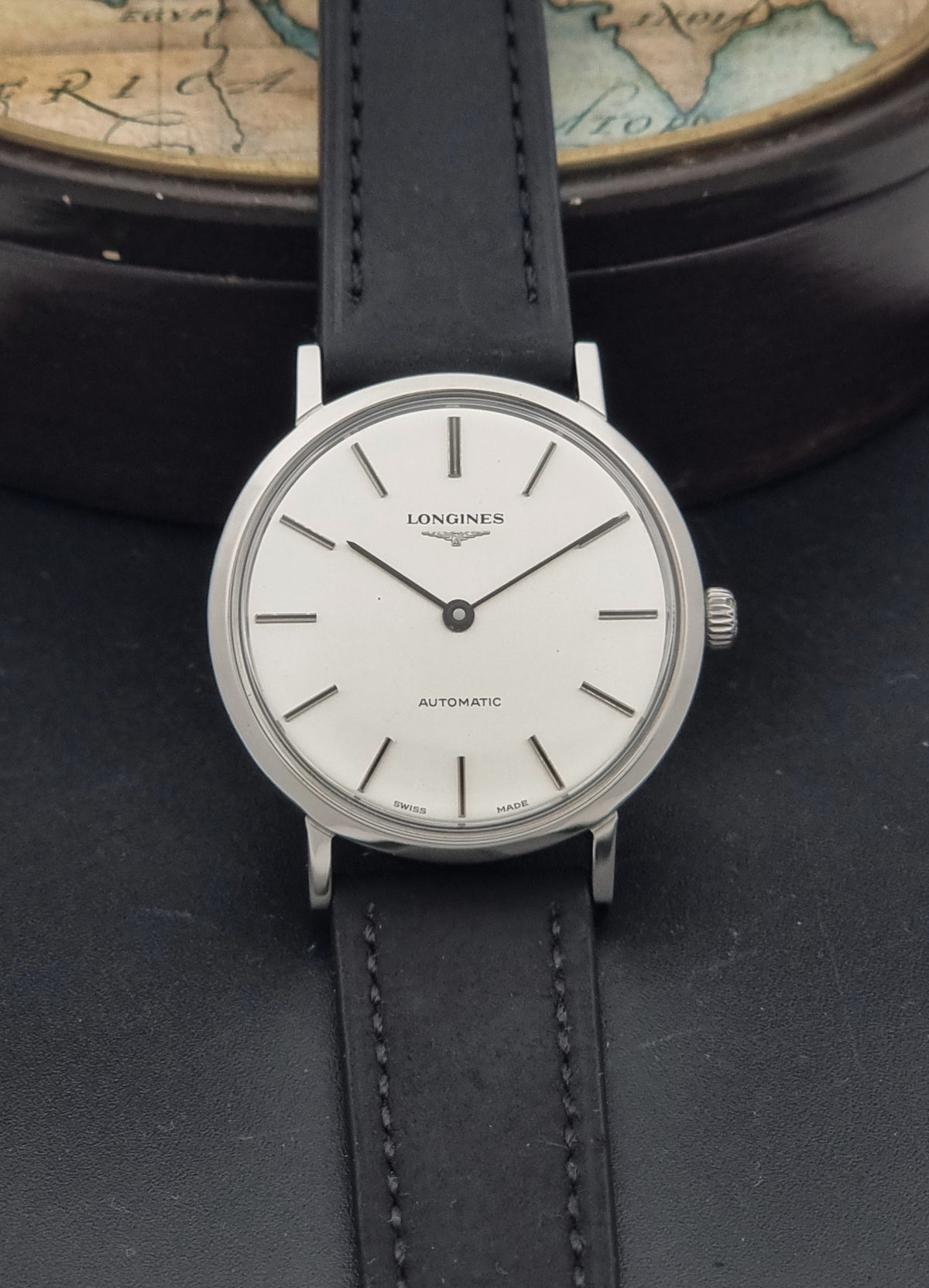 1975 vintage Longines 3029-1 automatic watch, alternate front view showing the vertically brushed silver two-hand dial and case