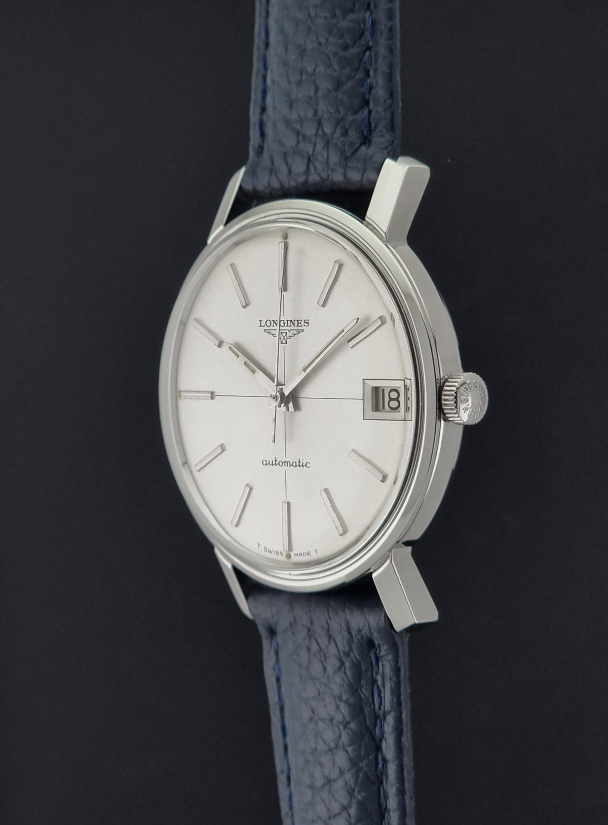 1966 vintage Longines 7570-5 automatic watch, close-up showing the crown and adjacent case flank