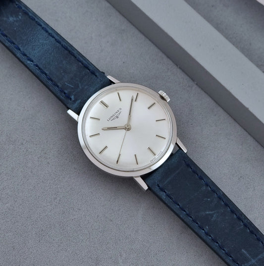 Vintage Longines Wristwatch 7839-3 with blue strap on a gray background dial