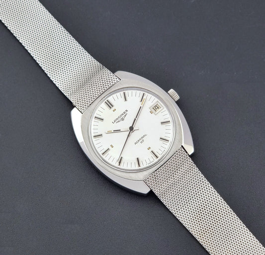 Vintage Longines Admiral Hi frequency Wristwatch 2304-2 with a mesh band on a dark gray background dial