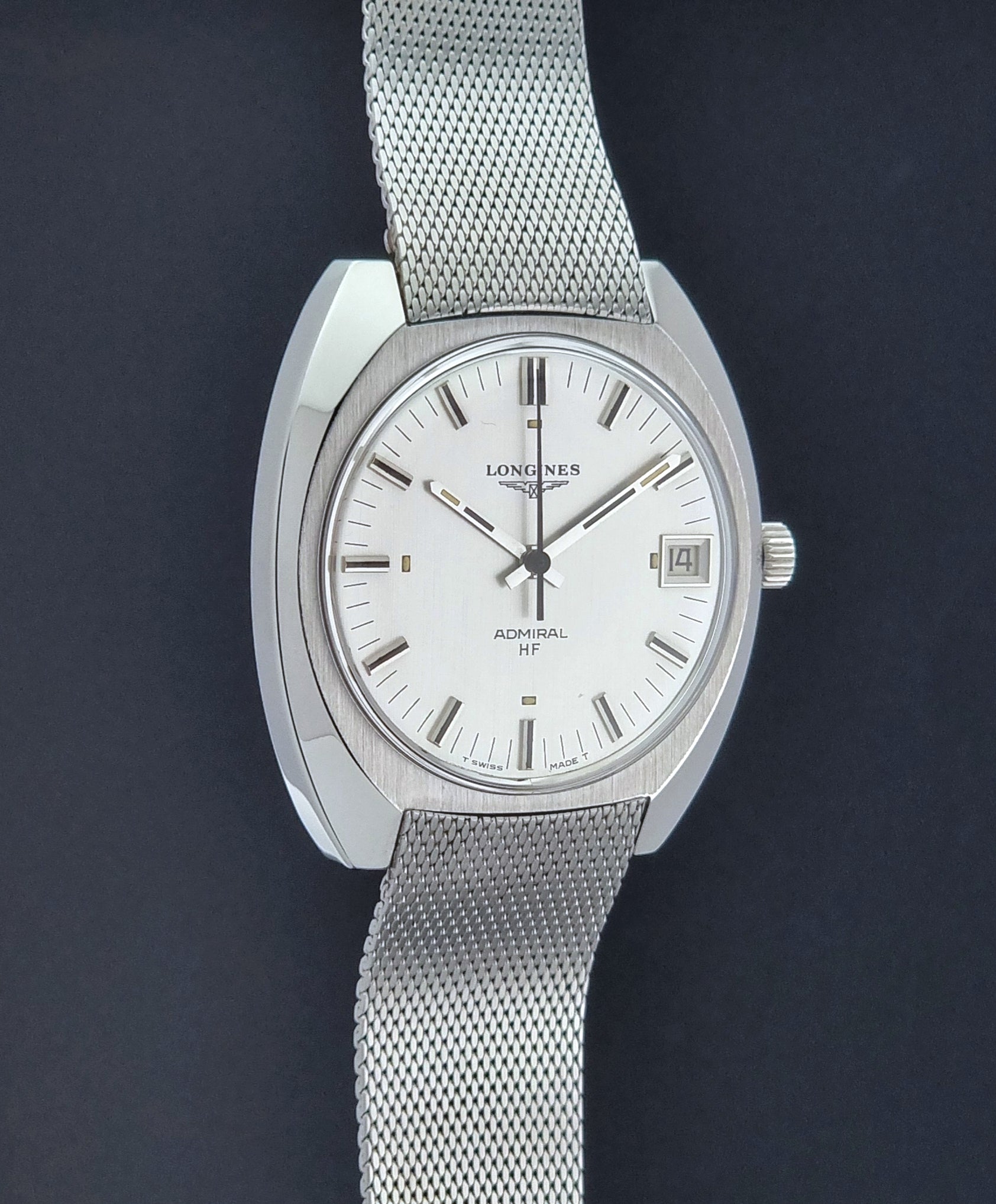 Vintage Longines Admiral Hi frequency Wristwatch 2304-2 with a mesh band on a dark gray background side profile view