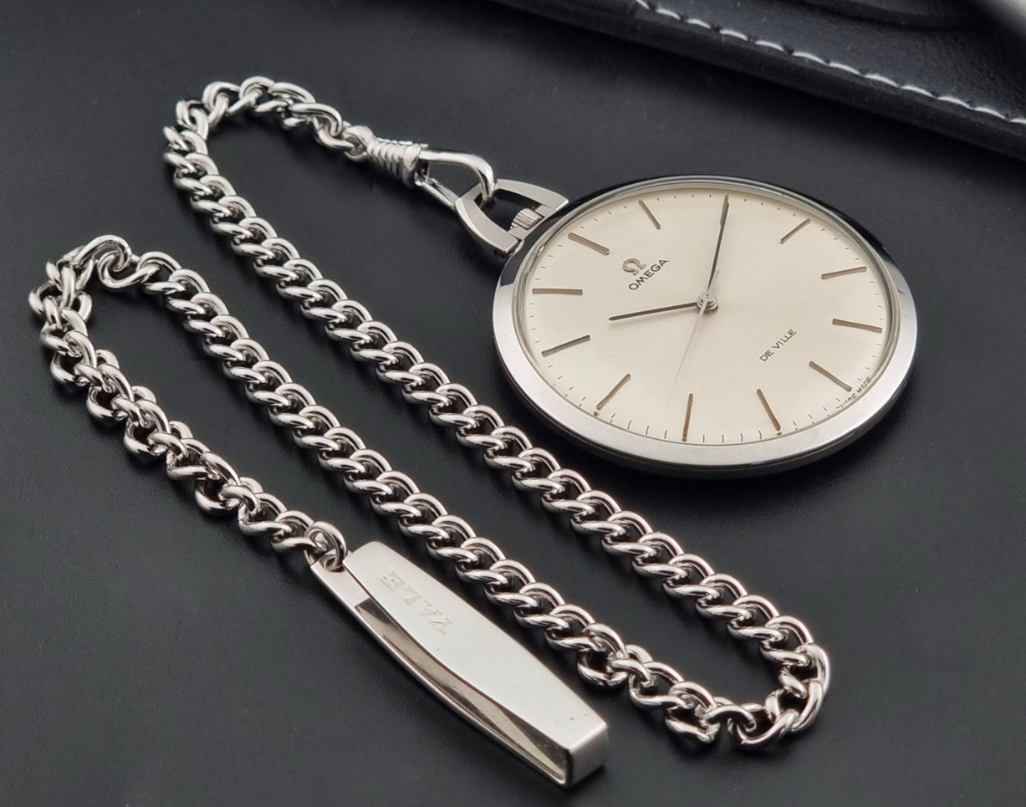 Vintage Omega De Ville Pocket Watch 131.1714 on a dark background chain view