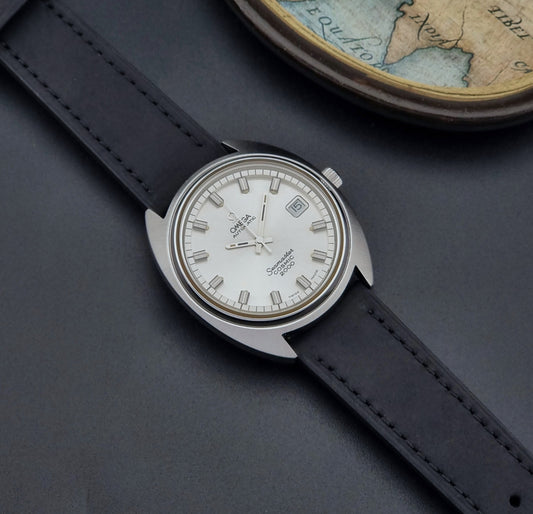 Vintage Omega Wristwatch 166.130 Seamaster Cosmic 2000 black leather strap on a dark surface dial