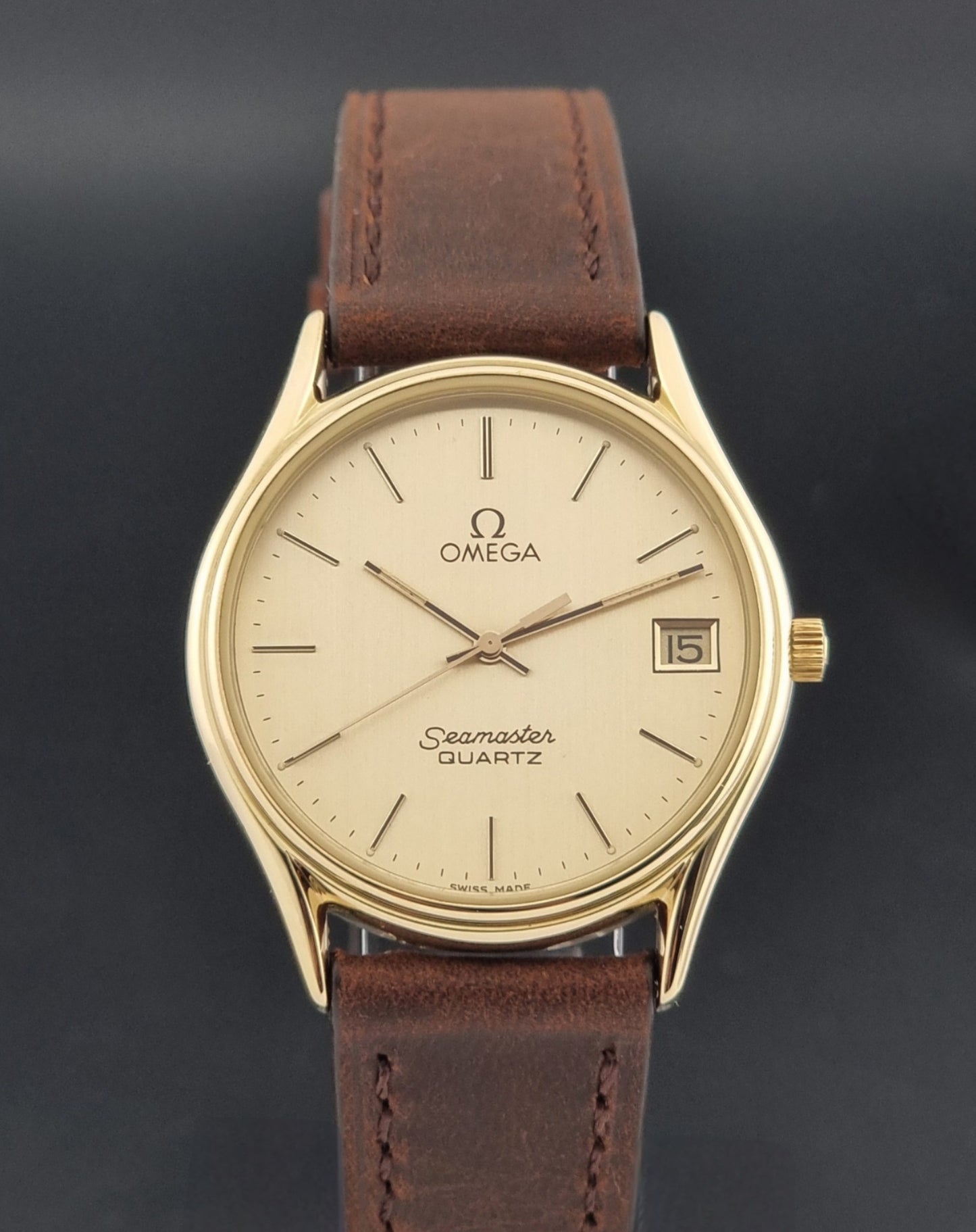 Vintage Omega Quartz Seamaster 196.0281 Wristwatch in a gold case close dial view
