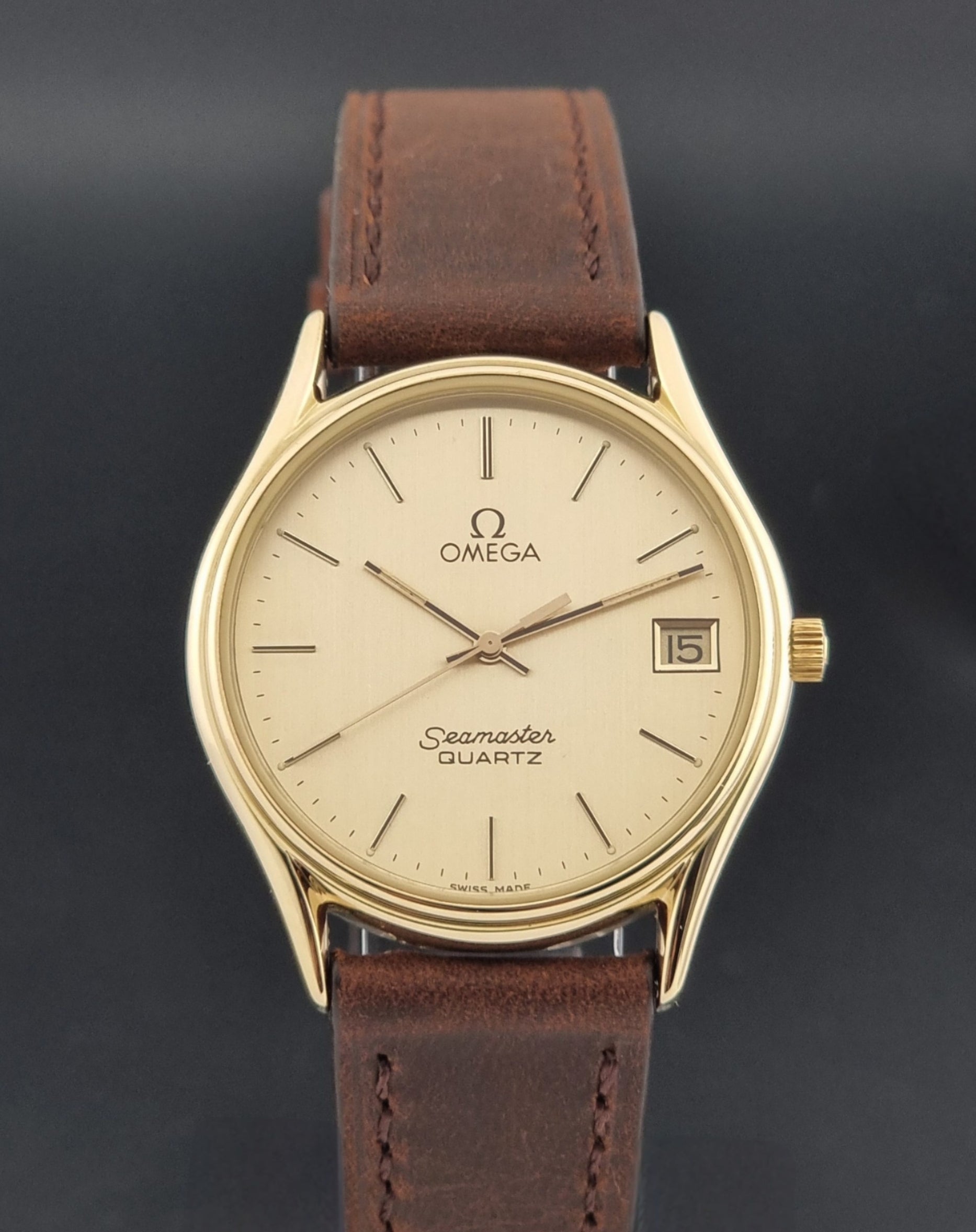 Vintage Omega Quartz Seamaster 196.0281 Wristwatch in a gold case close dial view