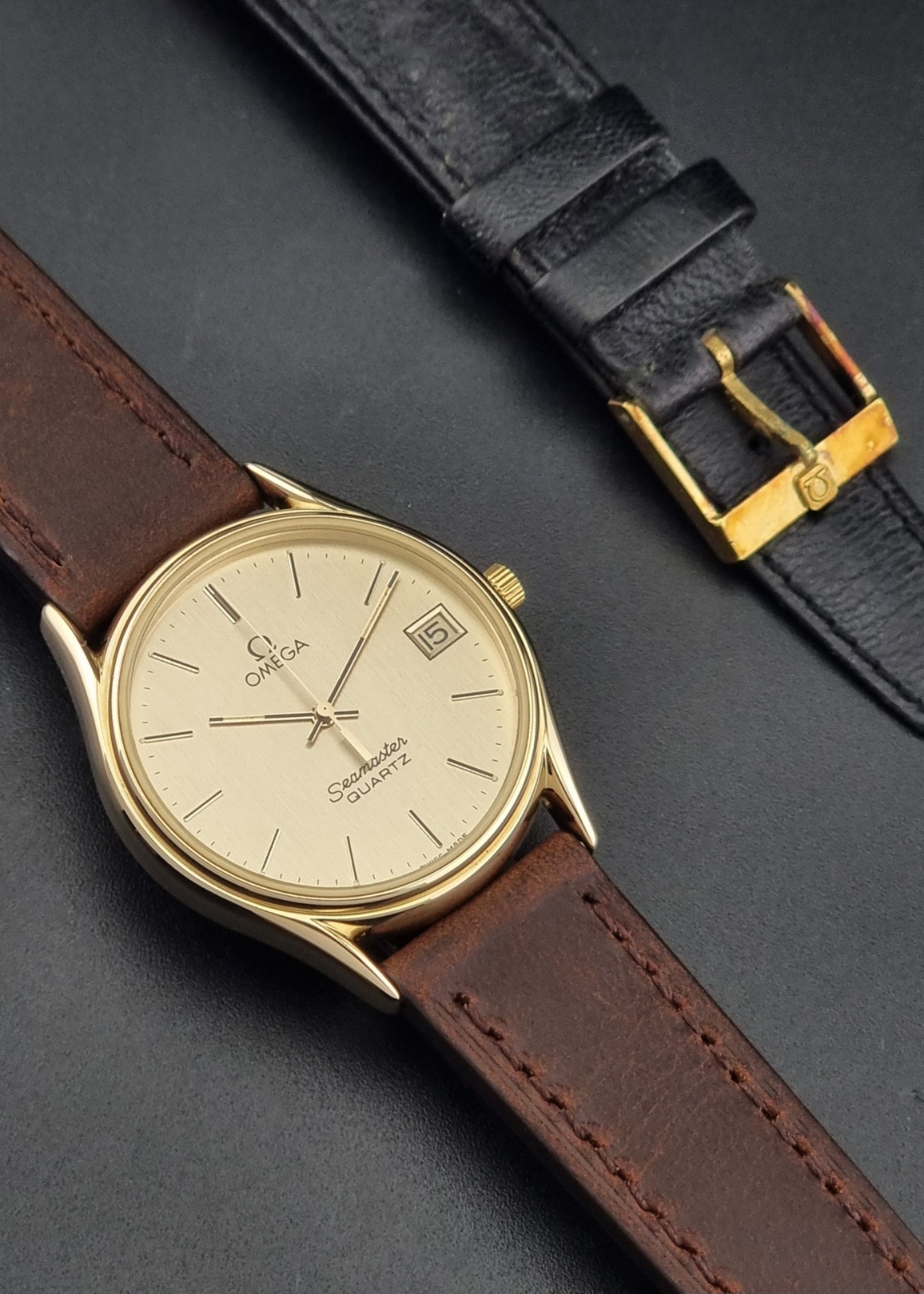 Vintage Omega Quartz Seamaster 196.0281 Wristwatch in a gold case front view