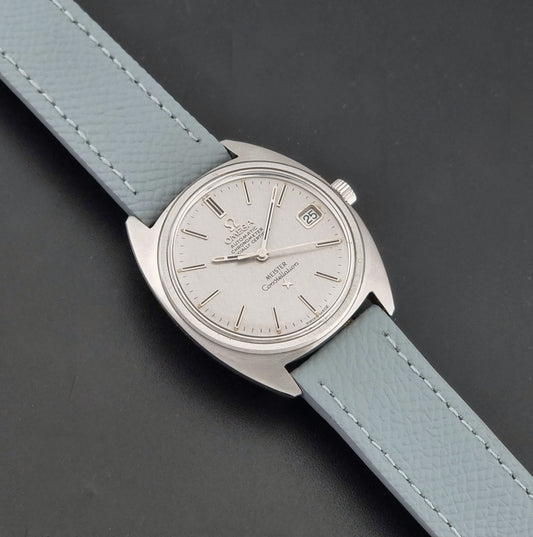 Vintage Omega Constellation 168.017 with a grey leather strap on a dark background dial
