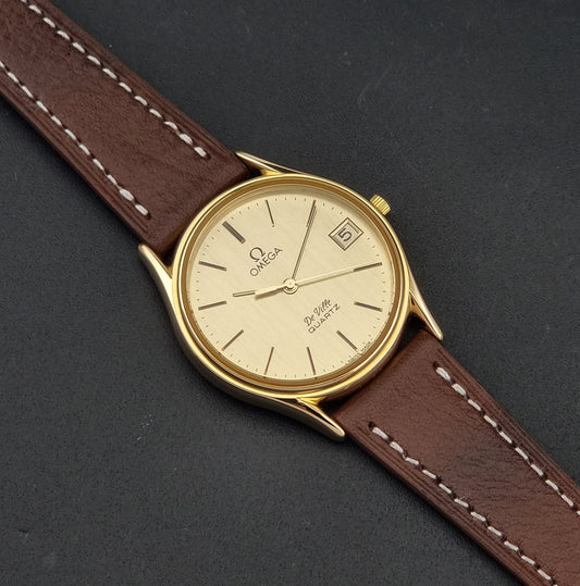 Vintage Omega De Ville 196.0205 Quartz Gold-Plated c.1980, front view of the dial and case, on a leather strap