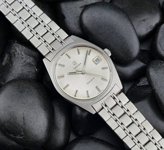 Vintage Omega Geneve watch on pebbles