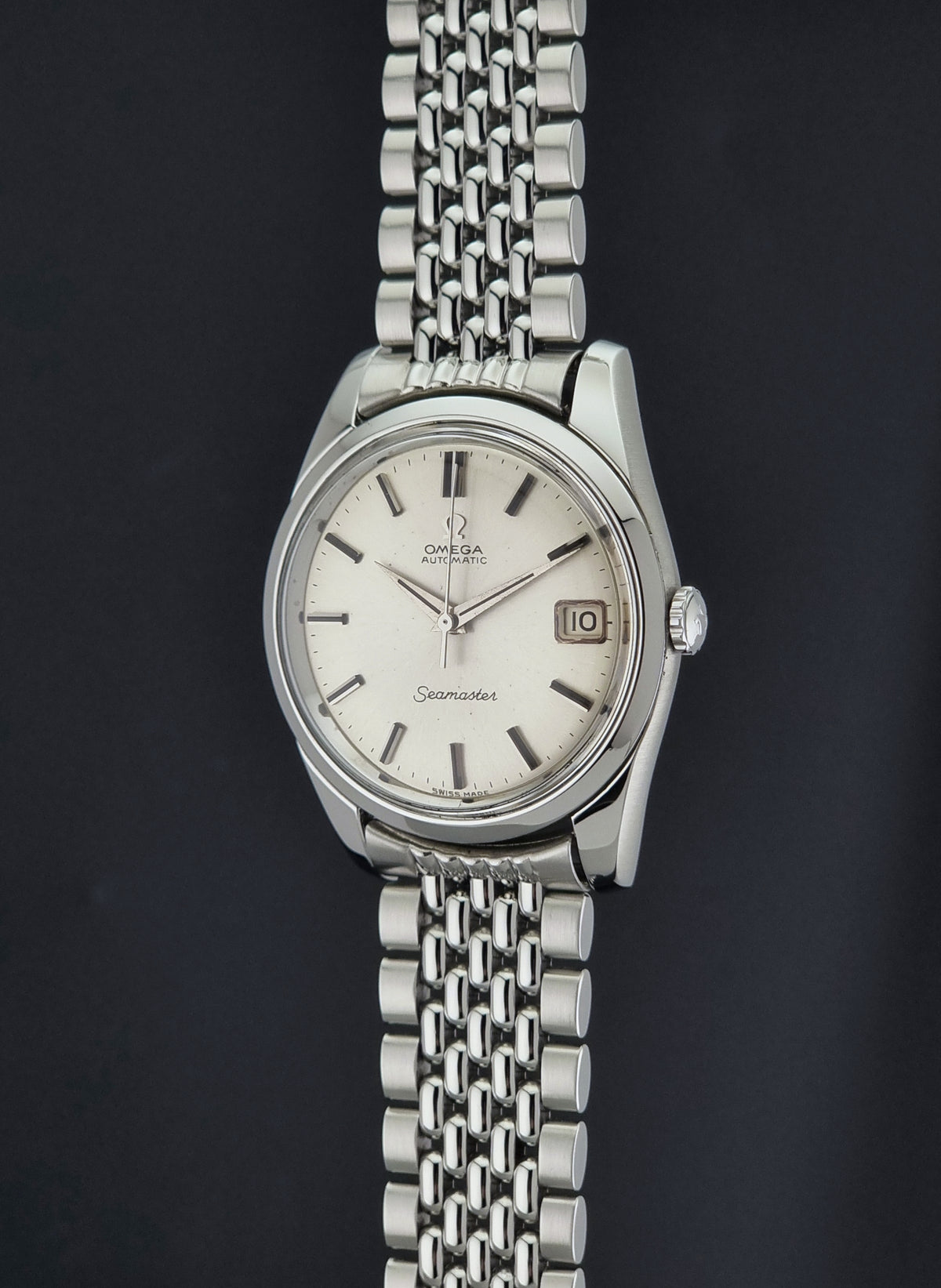 1966 vintage Omega Seamaster 166.010 automatic watch, close-up showing the crown and adjacent case flank