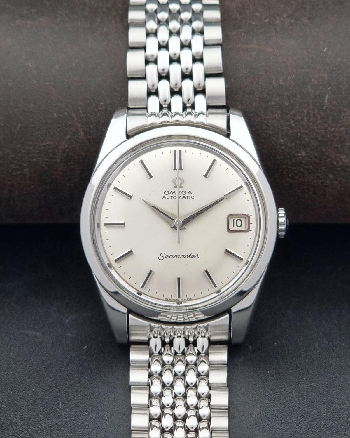 1966 vintage Omega Seamaster 166.010 automatic watch, alternate front view showing the silver sunburst dial and case