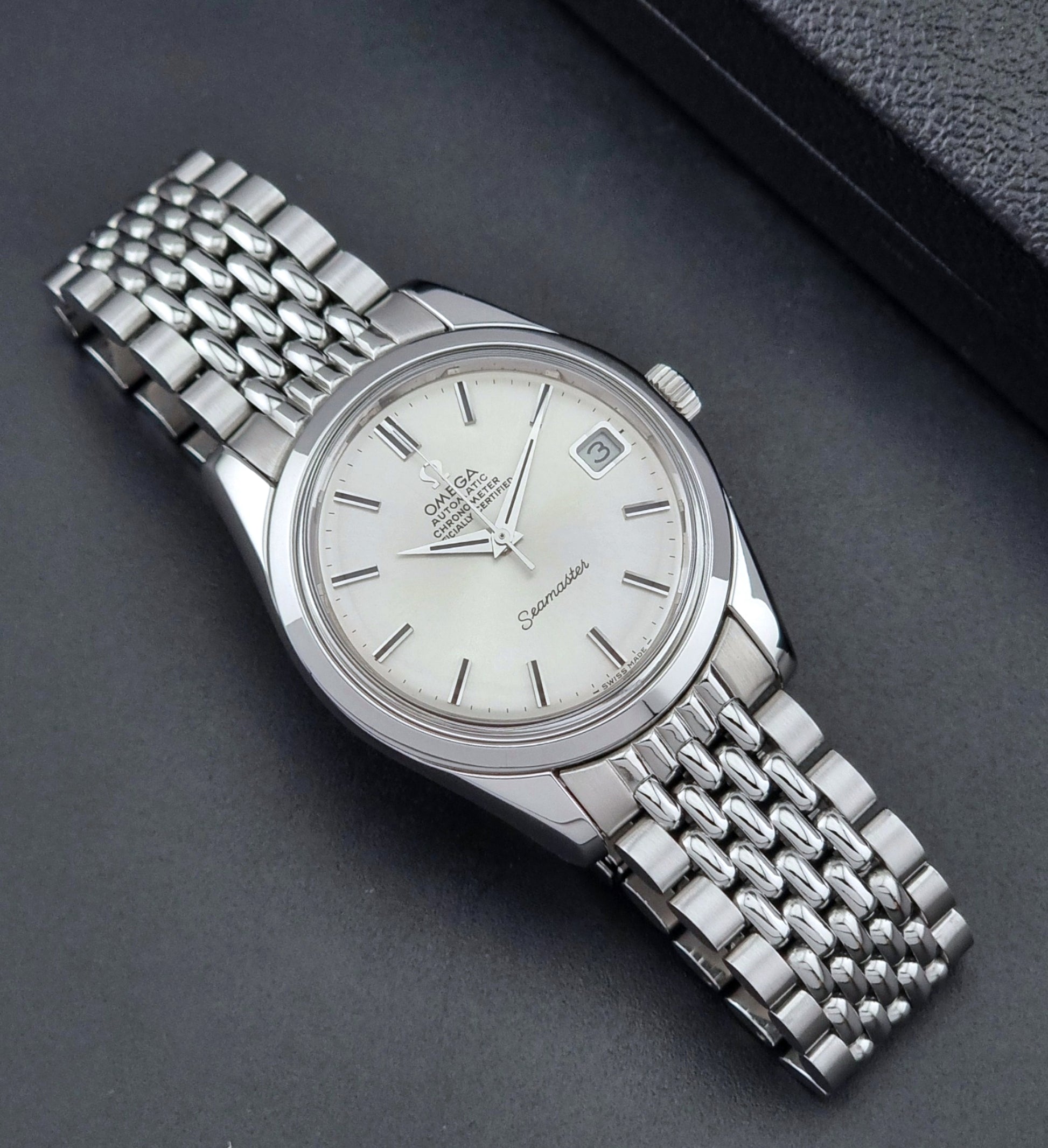 Vintage Omega Wristwatch Seamaster 166.010 watch on a dark gray background dial up