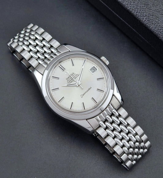 Vintage Omega Wristwatch Seamaster 166.010 watch on a dark gray background dial up