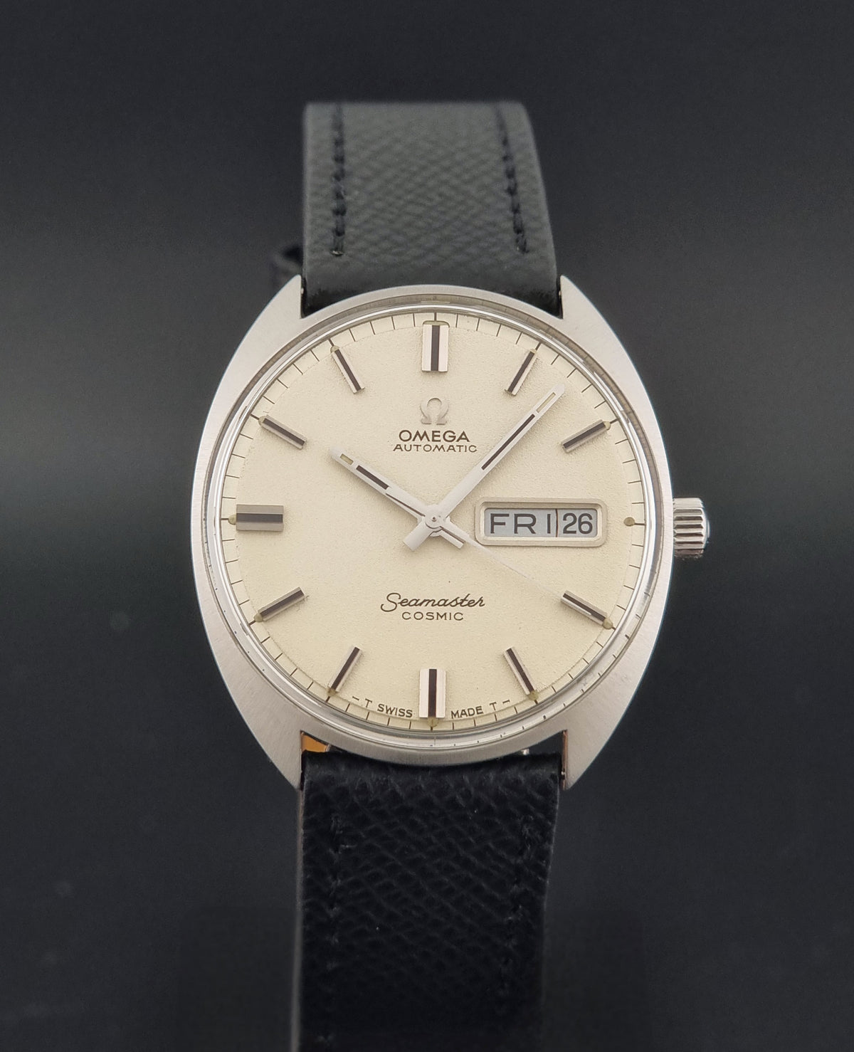 1970 vintage Omega Seamaster Cosmic 166.036 automatic watch, dial detail showing day-date display and tonneau-shaped case