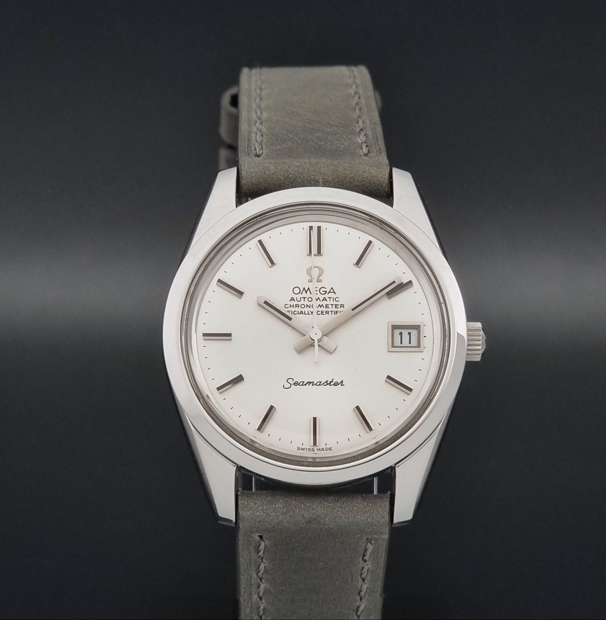 Vintage Omega Seamaster 168.0061/166.0172 watch on a grey strap and dark back ground close dial view