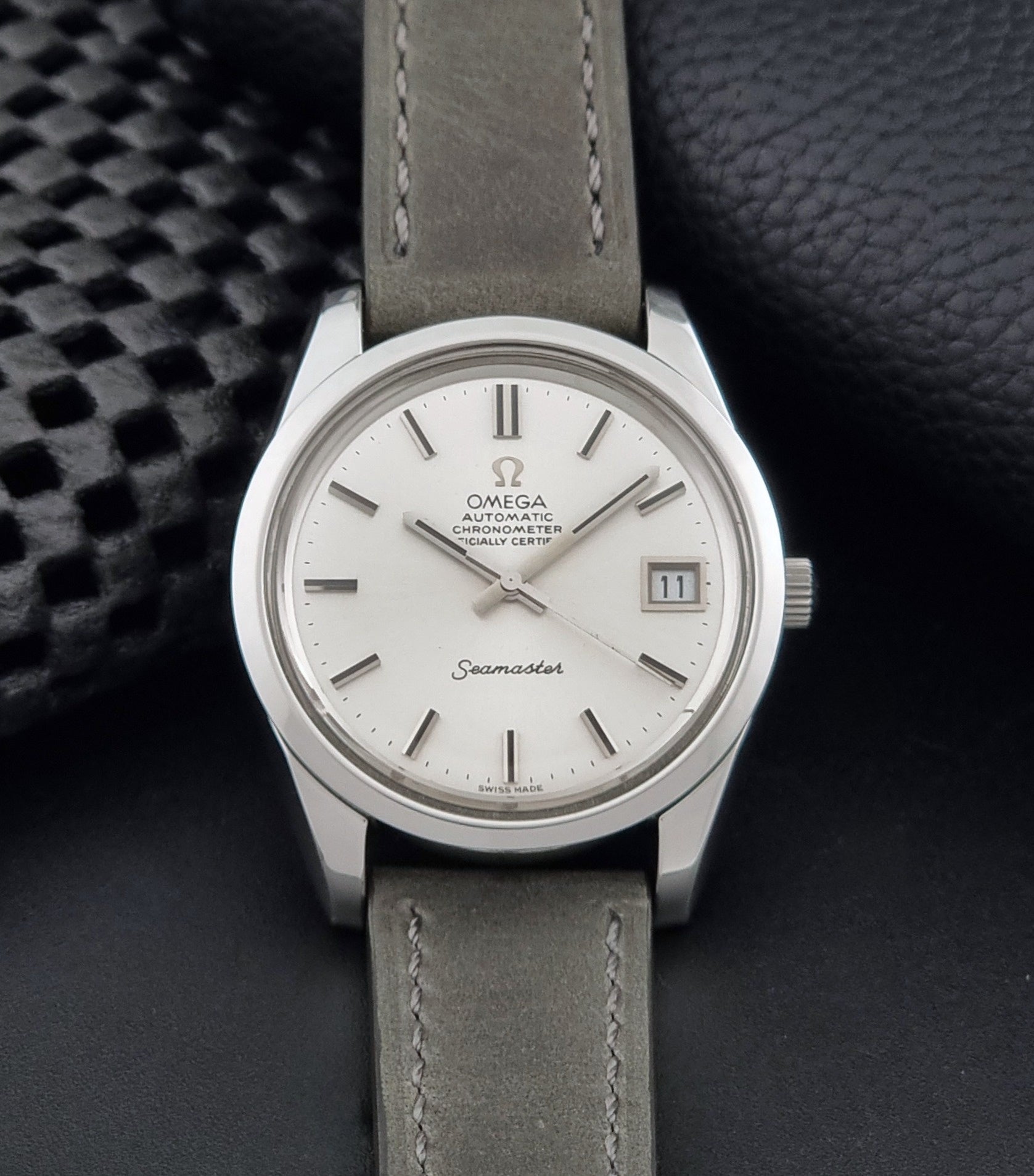 Vintage Omega Seamaster 168.0061/166.0172 watch on a grey strap and dark back ground dial view
