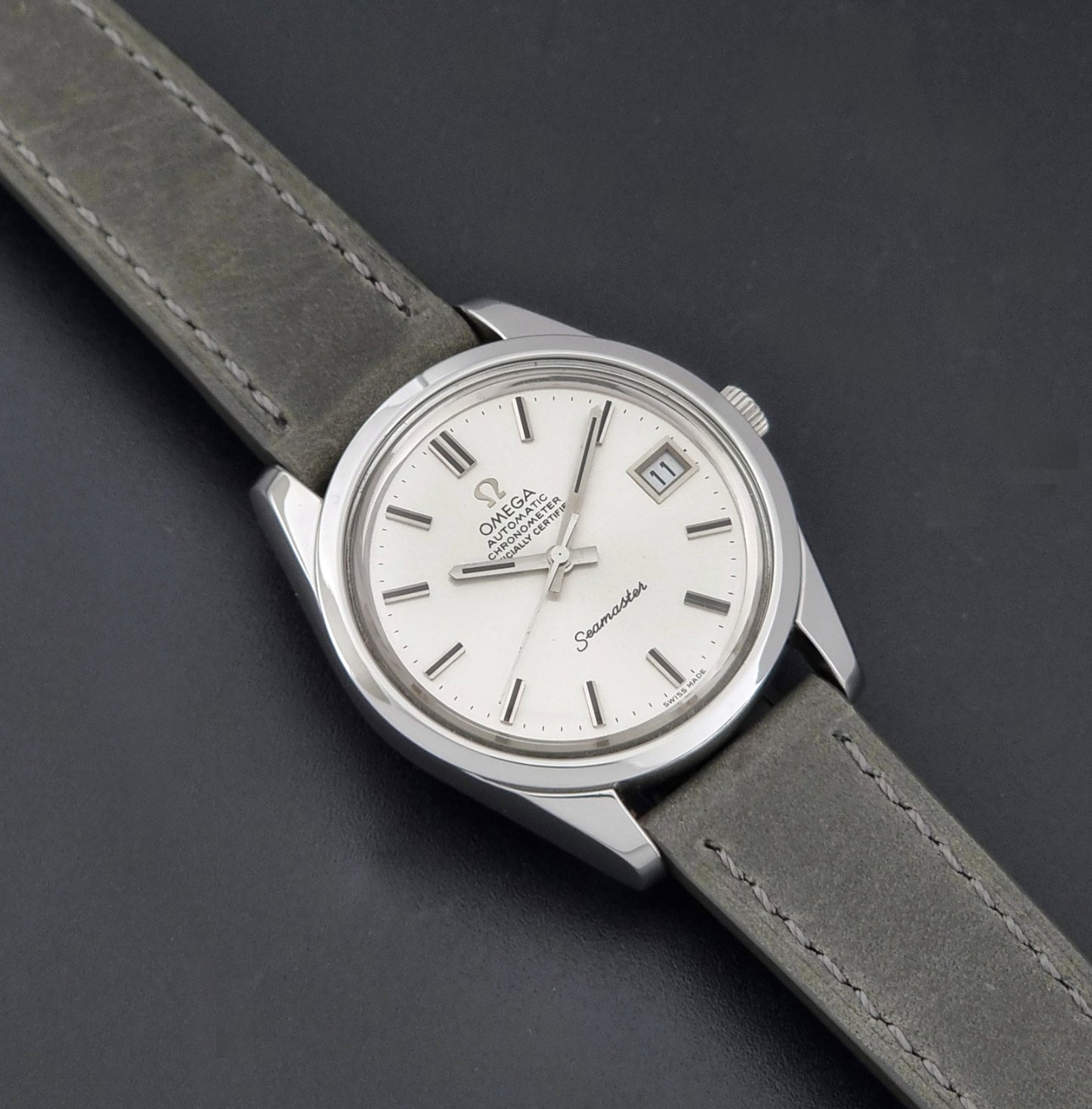 Vintage Omega Seamaster 168.0061/166.0172 watch on a grey strap and dark back ground dial