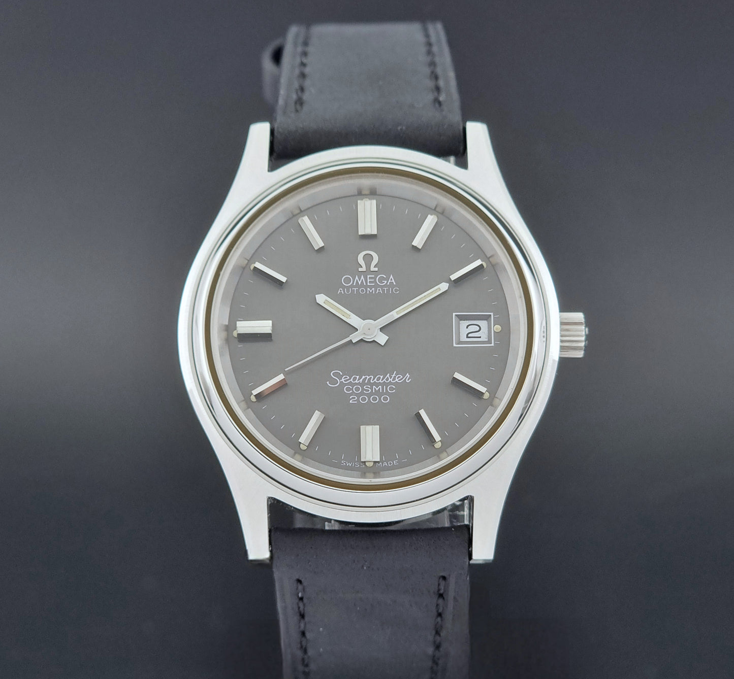 Vintage Omega Wristwatch Seamaster Cosmic 2000 Jumbo 166.128 black leather strap on a dark back ground dial view