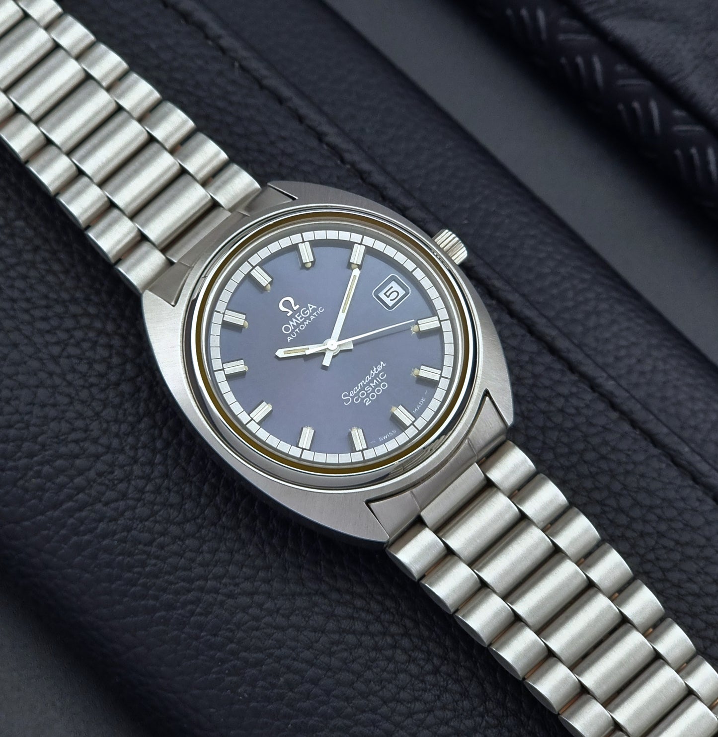 Vintage Omega Wristwatch Seamaster Cosmic 2000 Jumbo 166.130 watch with  stainless steel bracelet on a dark background 