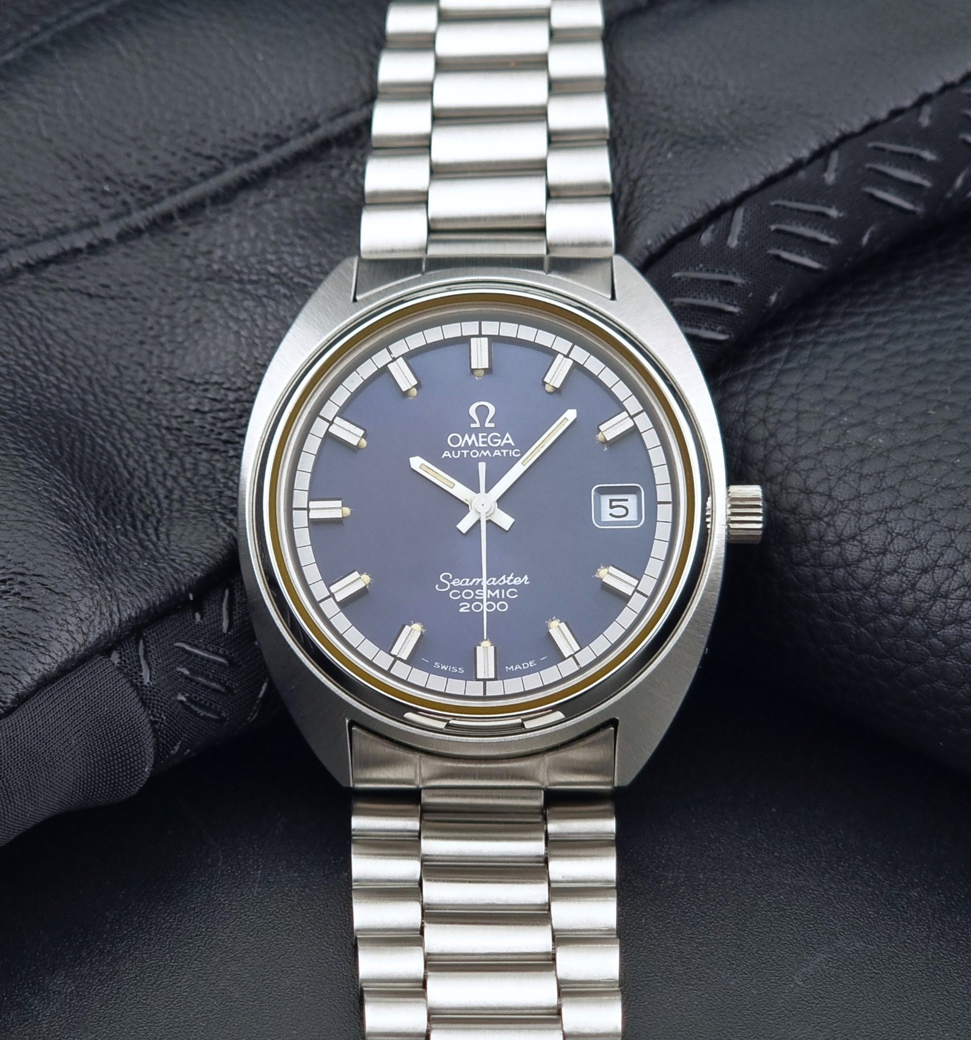 Vintage Omega Wristwatch Seamaster Cosmic 2000 Jumbo 166.130 watch with  stainless steel bracelet on a dark background front