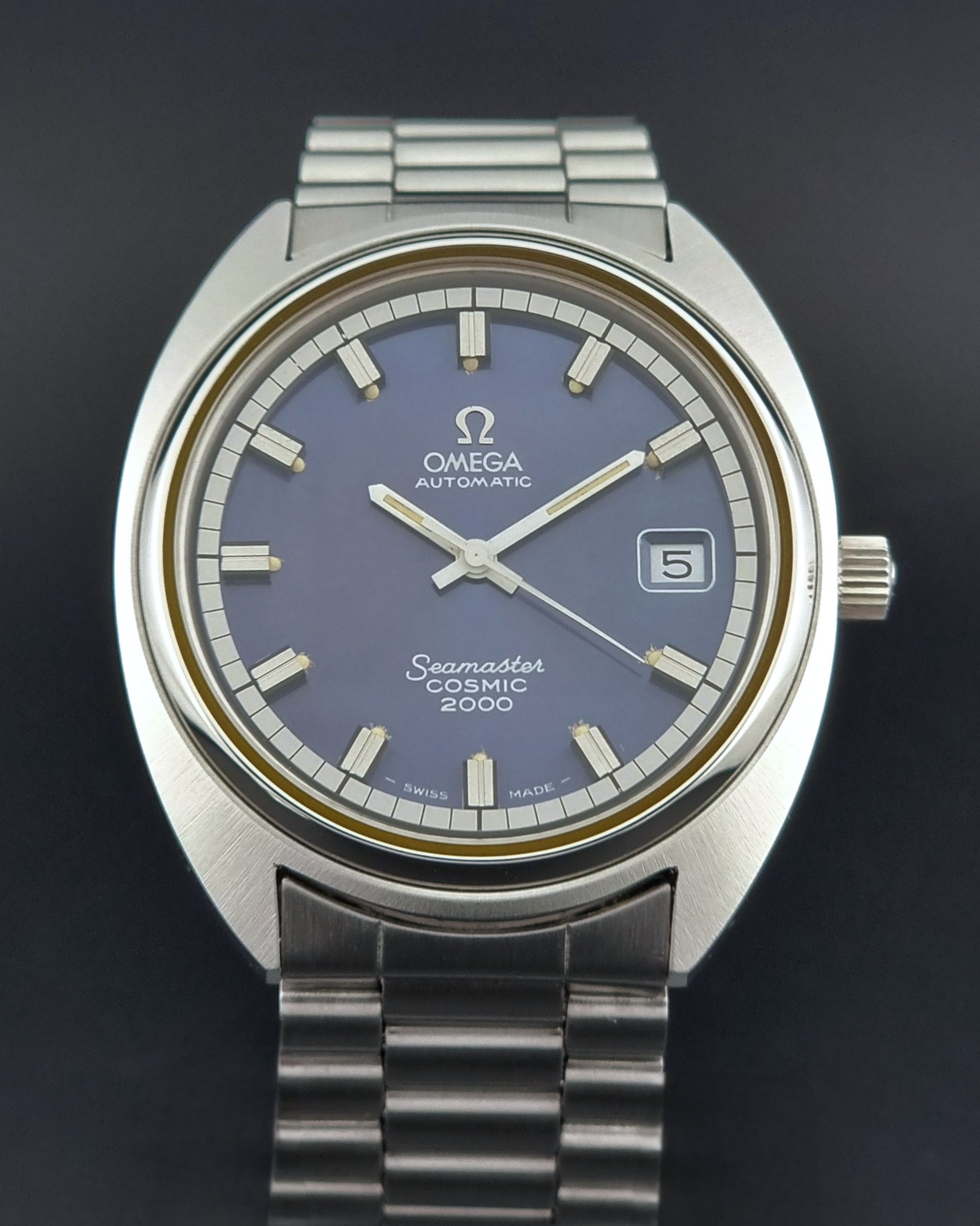 Vintage Omega Wristwatch Seamaster Cosmic 2000 Jumbo 166.130 watch with  stainless steel bracelet on a dark background close front view
