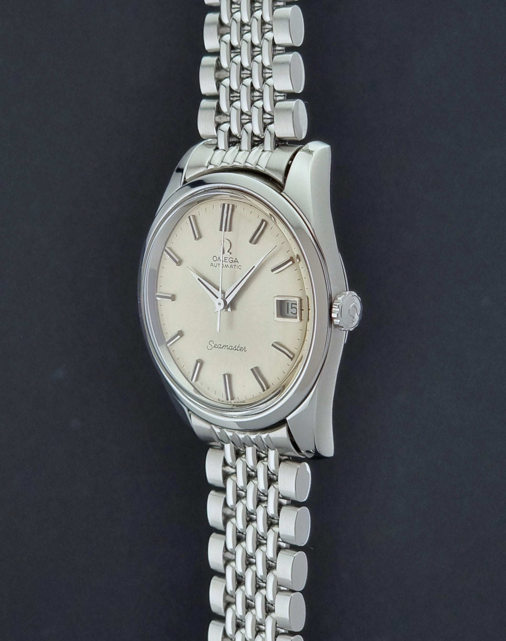 Vintage Omega Wristwatch Seamaster 166.010 with a detailed face on a dark background side profile view