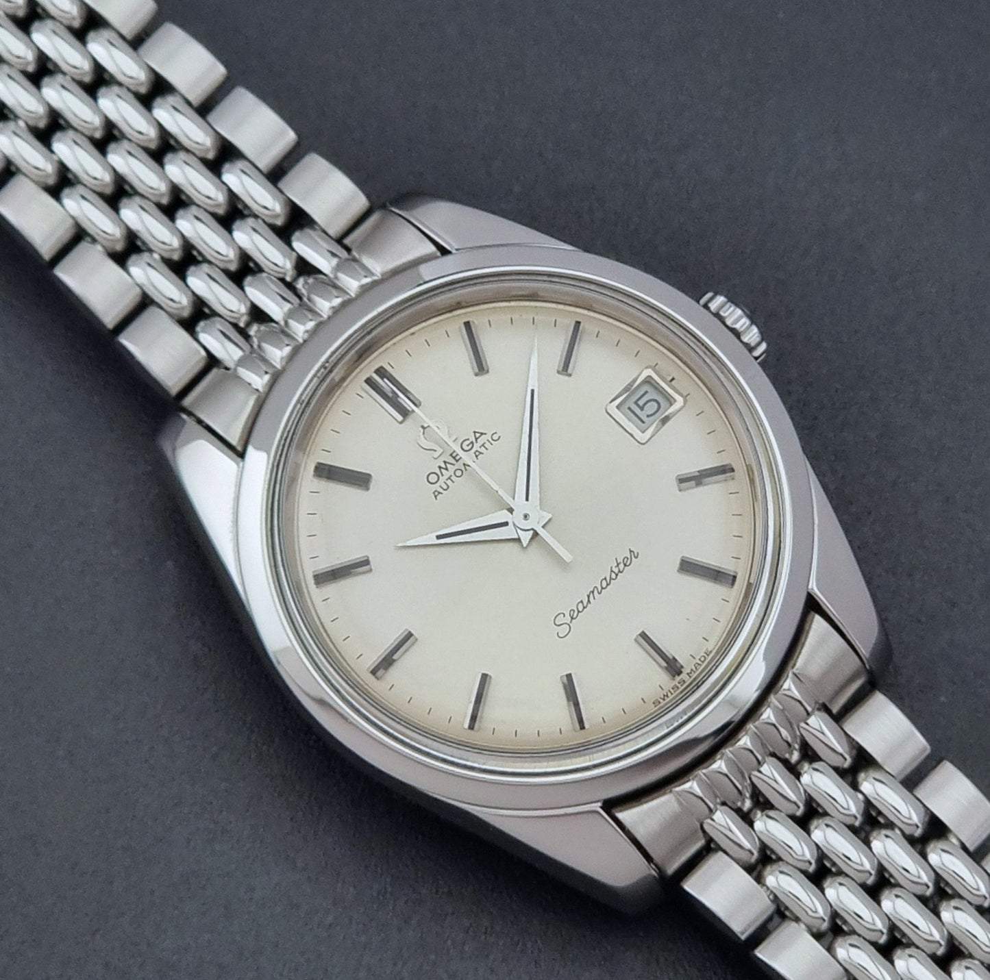 Vintage Omega Wristwatch Seamaster 166.010 with a detailed face on a dark background close up dial view