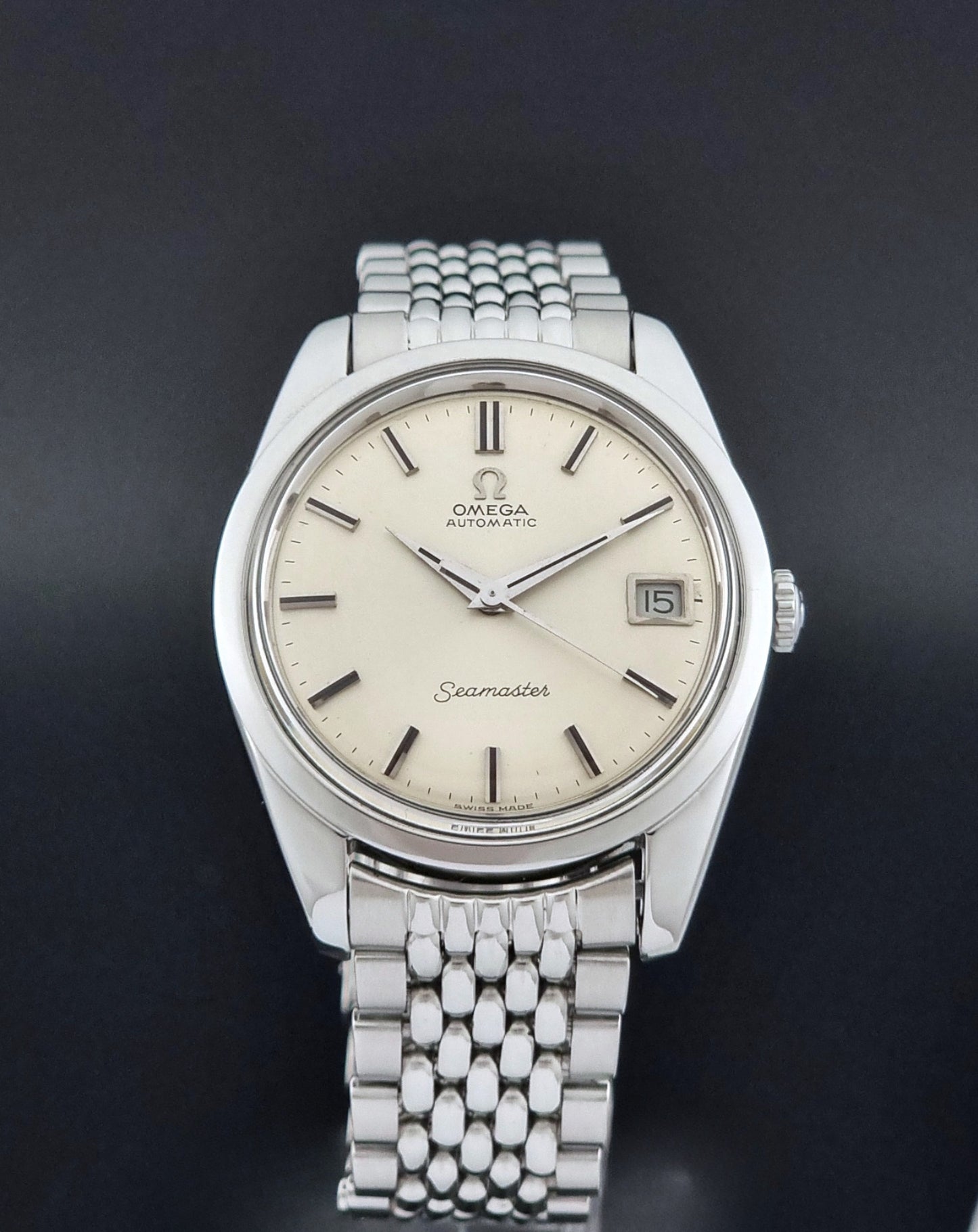 Vintage Omega Wristwatch Seamaster 166.010 with a detailed face on a dark background close dial view