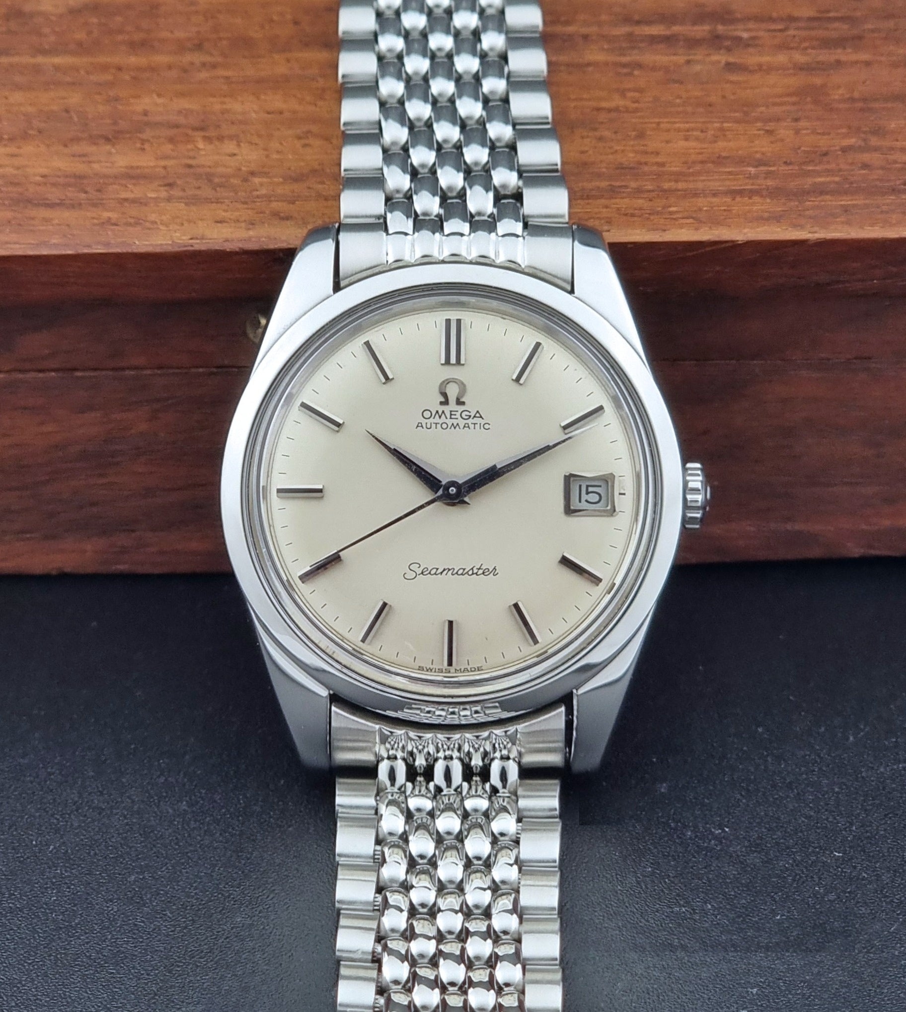 Vintage Omega Wristwatch Seamaster 166.010 with a detailed face on a dark background dial view