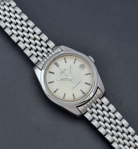 Vintage Omega Wristwatch Seamaster 166.010 with a detailed face on a dark background dial
