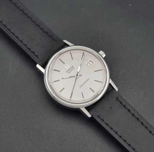 Vintage Omega Seamaster Quartz 196.0079 1977, front view of the dial and case, on a leather strap