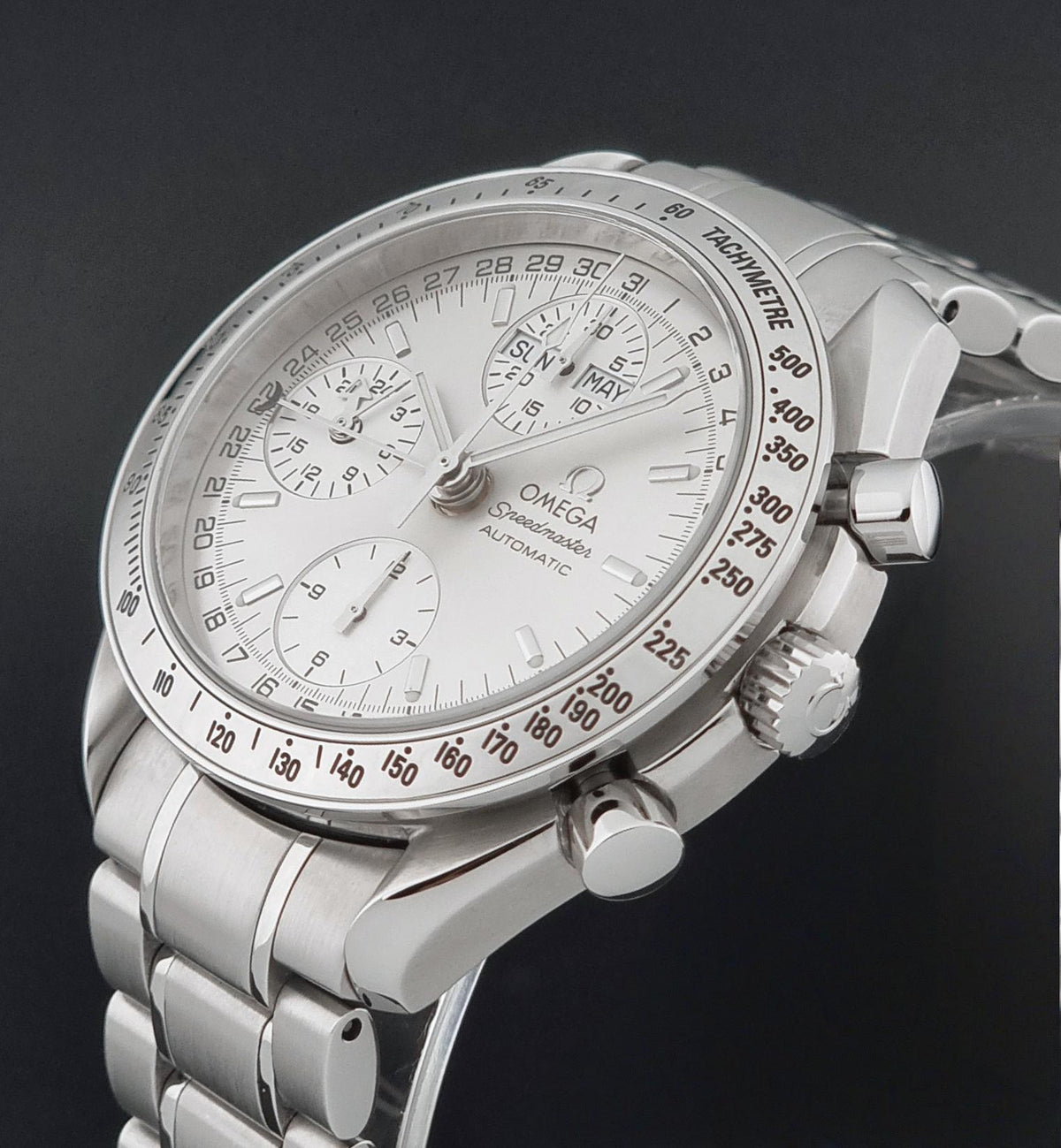 1999 Omega Speedmaster 3523.30 Triple Date automatic chronograph, close-up showing the crown and adjacent case flank