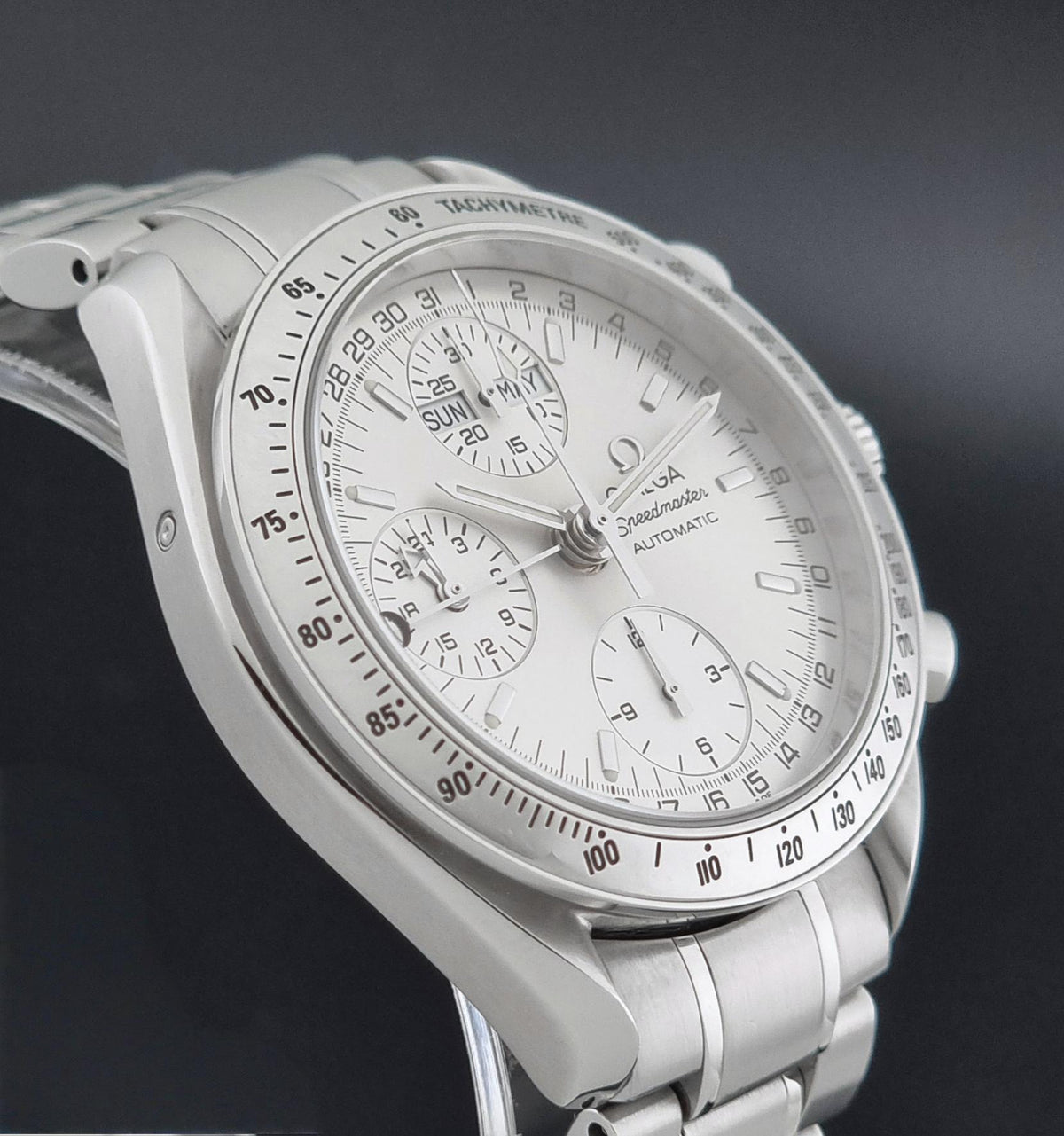1999 Omega Speedmaster 3523.30 Triple Date automatic chronograph, opposite side profile showing the case shape and lugs