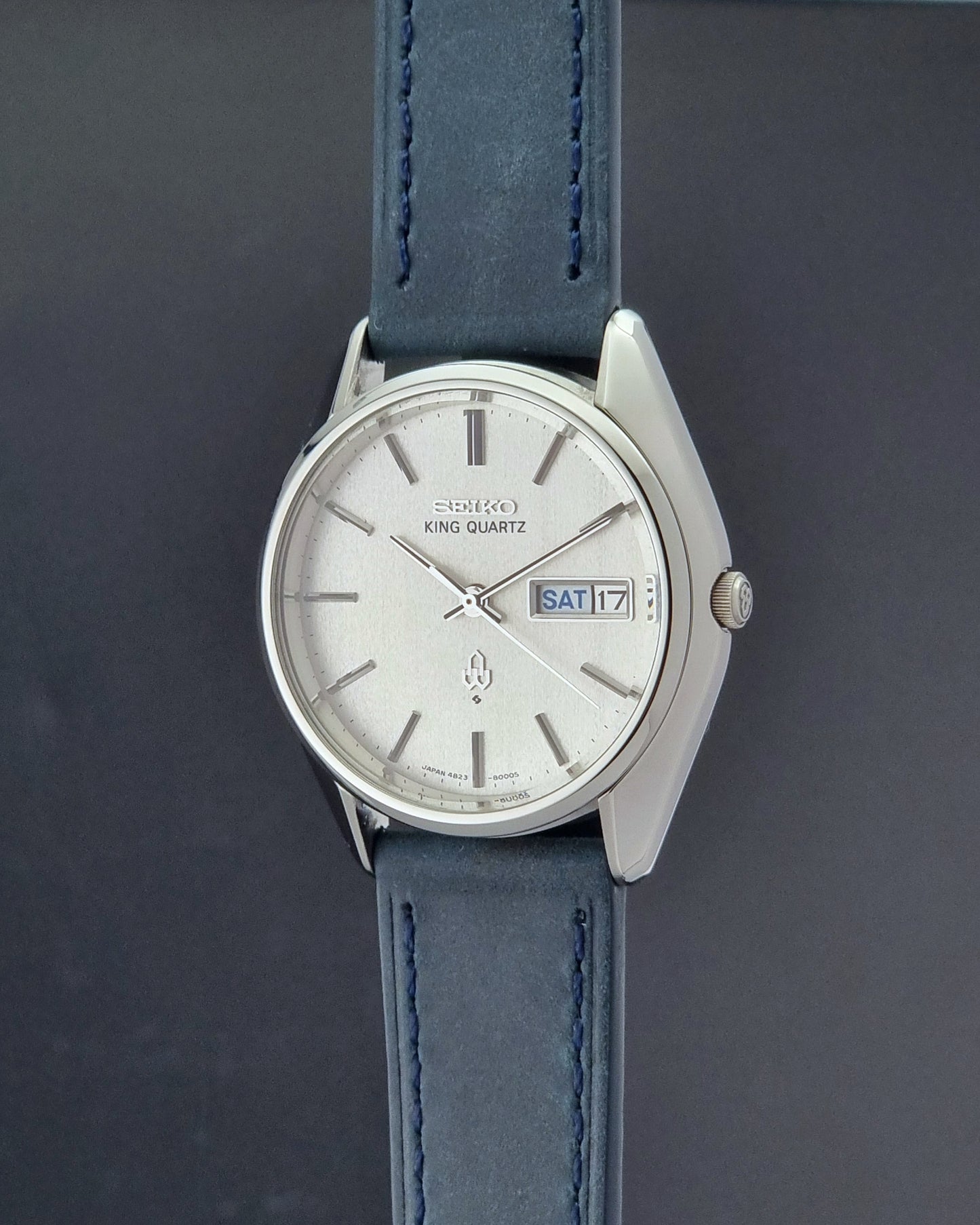 Vintage Seiko King Quartz 4823-8000-G with a blue leather strap on a dark background crown profile view