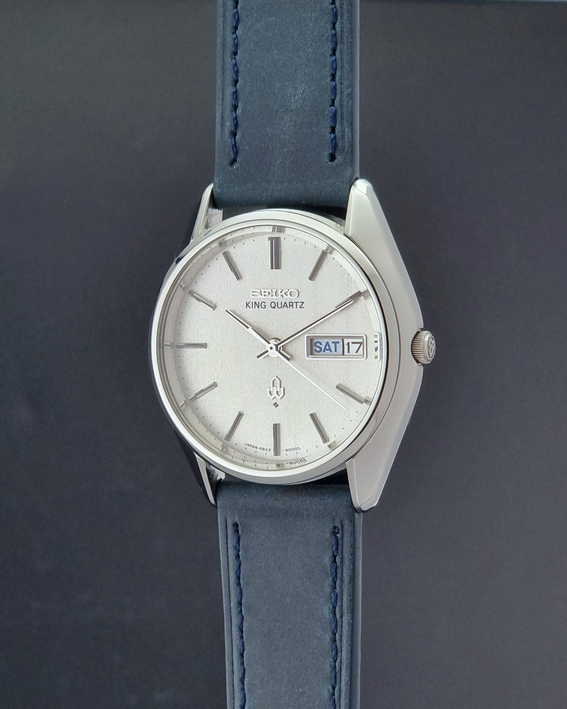 Vintage Seiko King Quartz 4823-8000-G with a blue leather strap on a dark background crown profile view