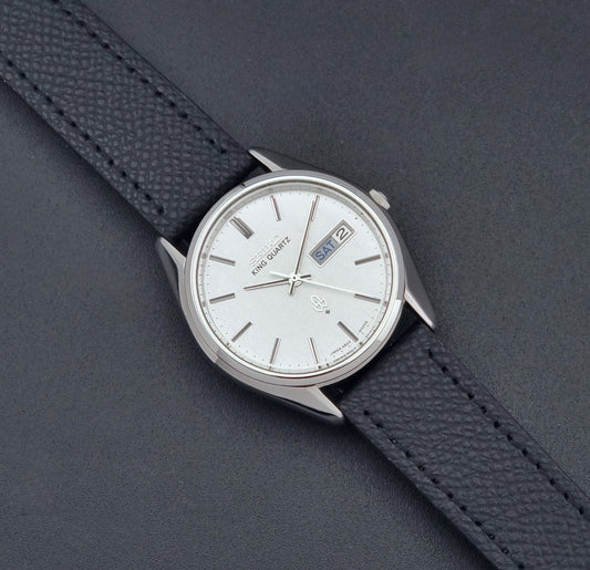 Vintage Seiko King Quartz watch 4823-8000  with black leather strap on a dark background dial 