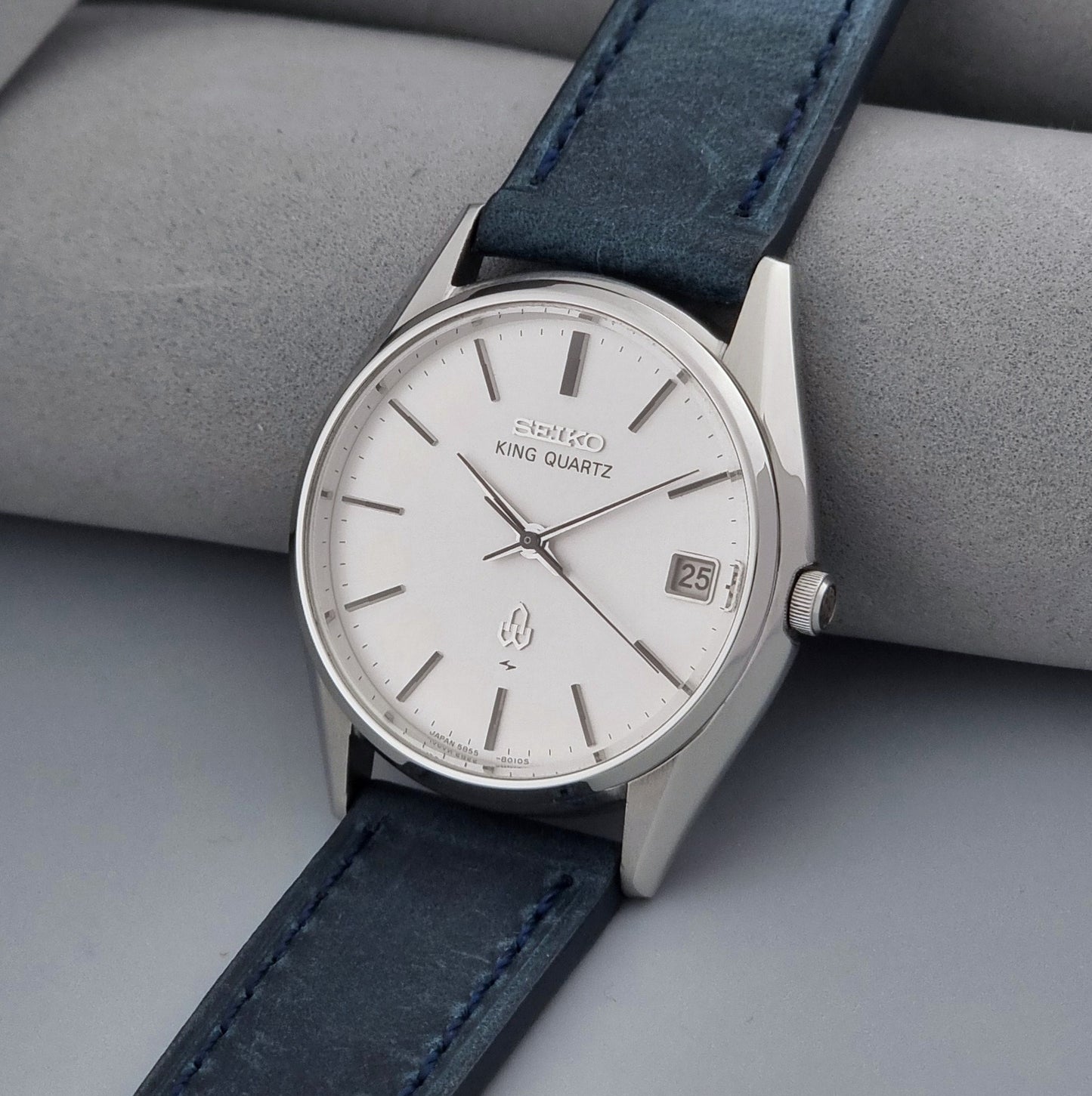 Vintage Seiko King Quartz watch 5855-8010 with blue leather strap on a gray background crown view