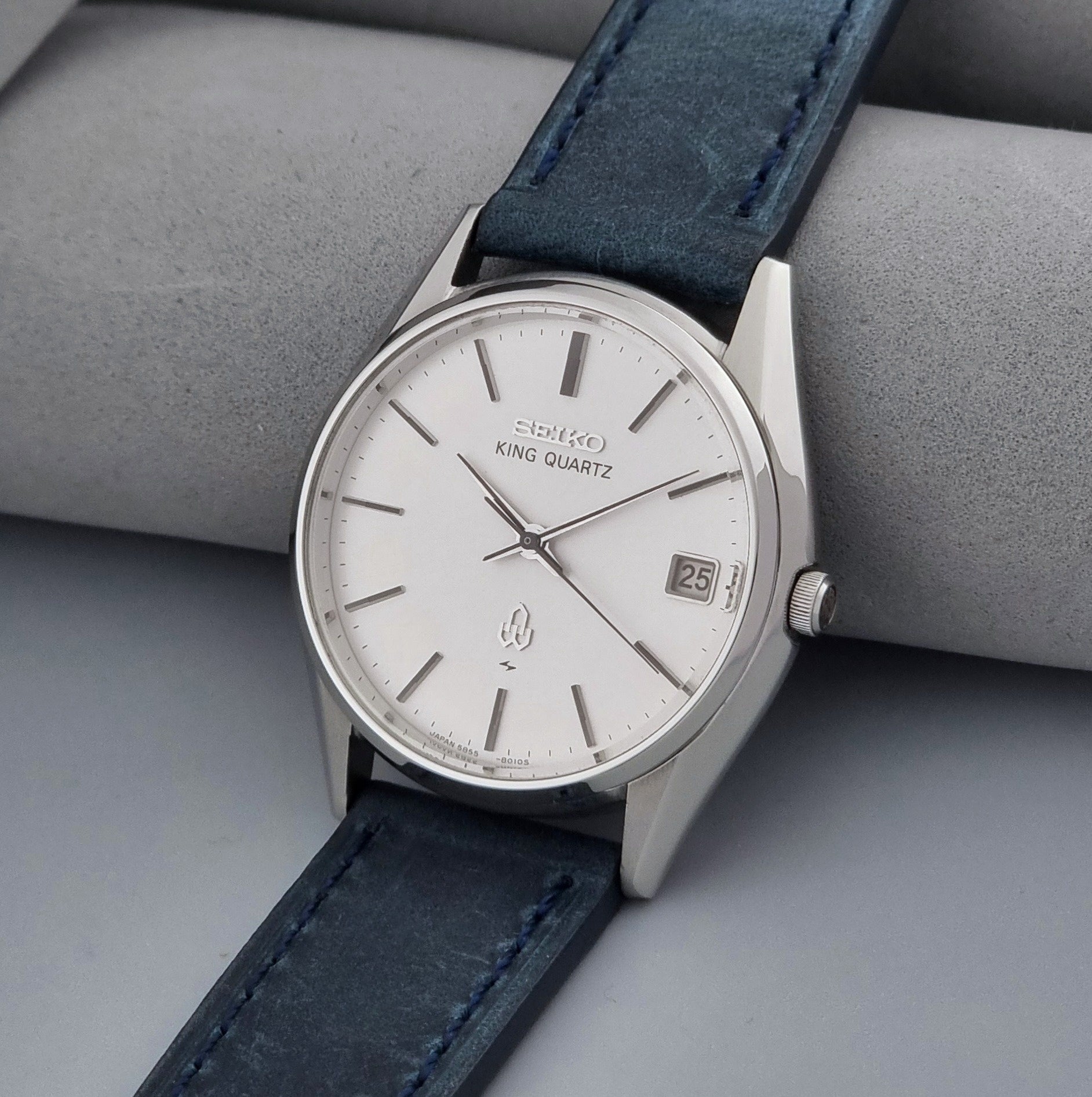 Vintage Seiko King Quartz watch 5855-8010 with blue leather strap on a gray background crown view