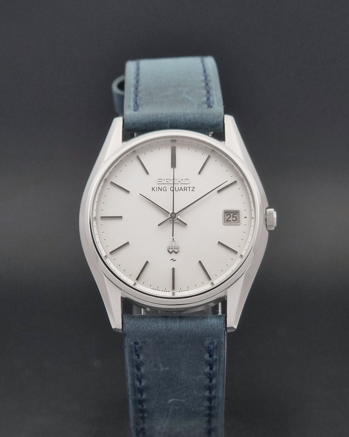 Vintage Seiko King Quartz watch 5855-8010 with blue leather strap on a gray background close dial view
