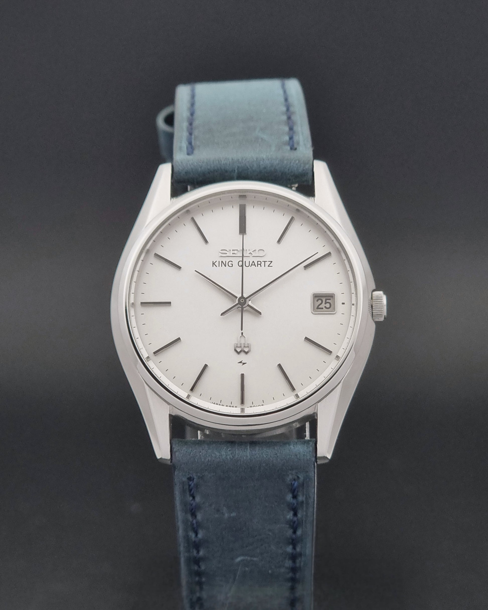 Vintage Seiko King Quartz watch 5855-8010 with blue leather strap on a gray background close dial view