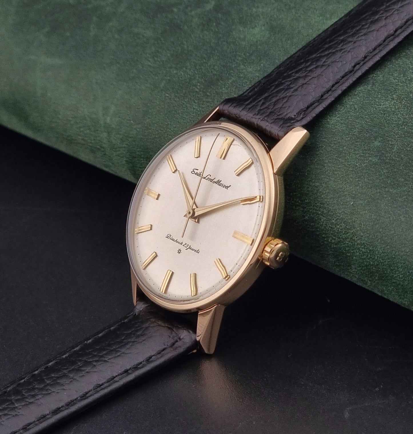 Vintage Seiko watch Lord Marvel 15023E gold filled on a dark background crown view