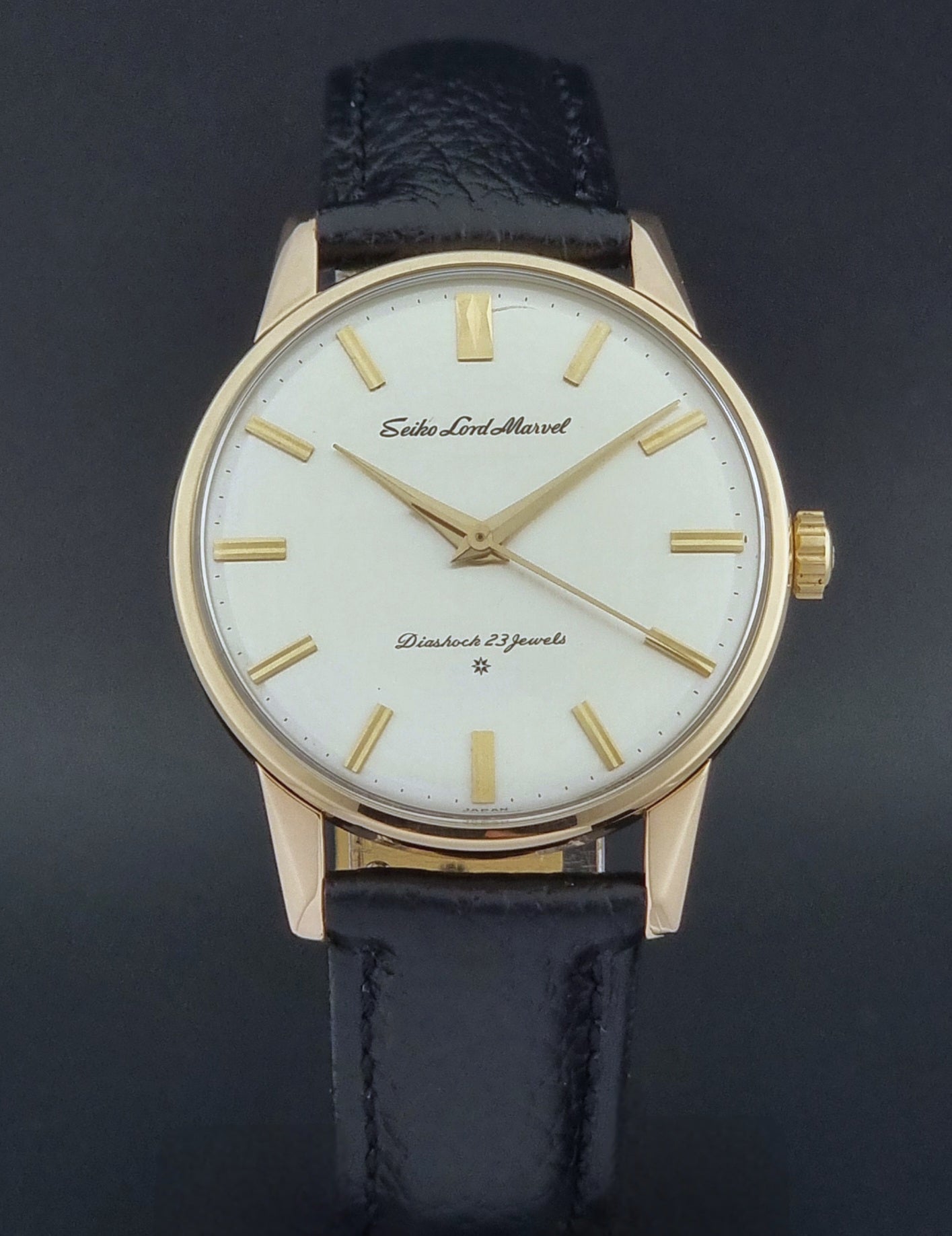 Vintage Seiko watch Lord Marvel 15023E gold filled on a dark background close dial view