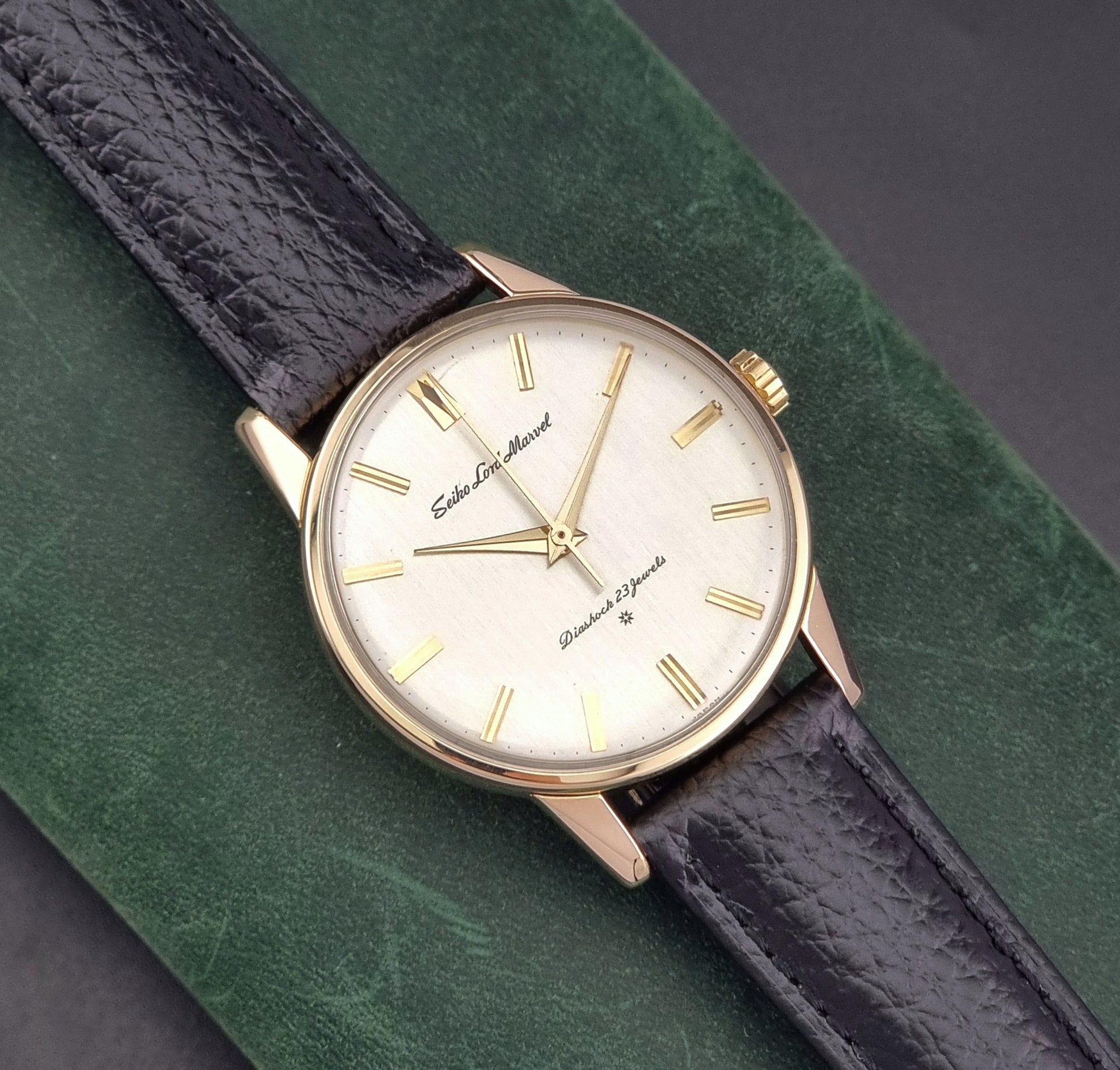 Vintage Seiko watch Lord Marvel 15023E gold filled on a dark background close up dial view
