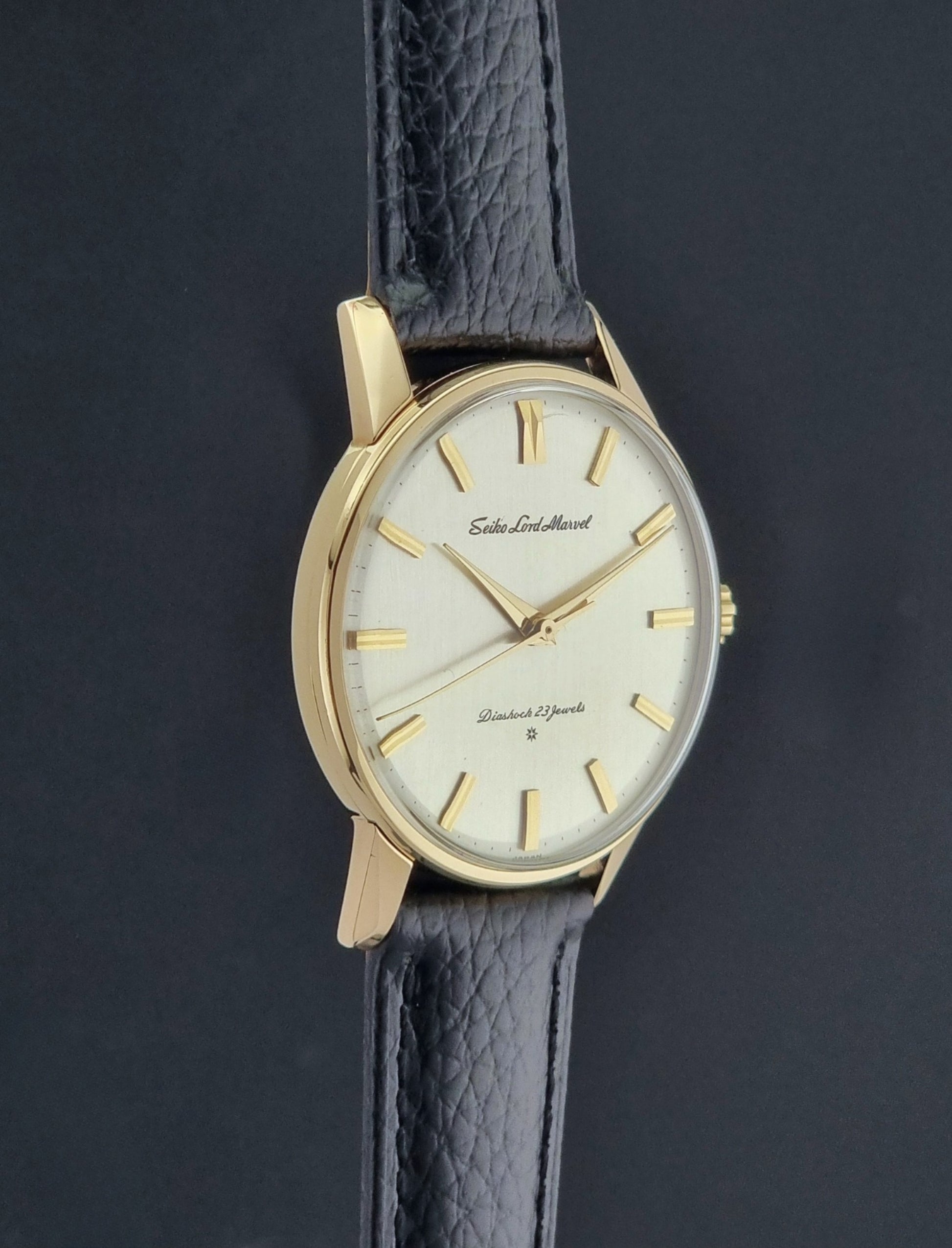 Vintage Seiko watch Lord Marvel 15023E gold filled on a dark background side profile view