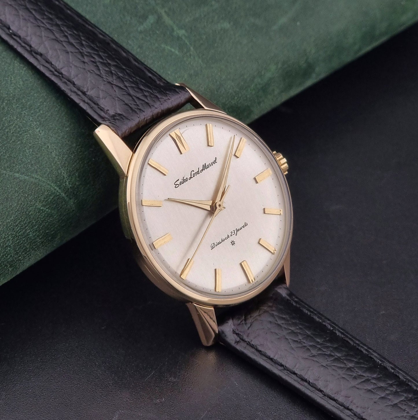 Vintage Seiko watch Lord Marvel 15023E gold filled on a dark background side view