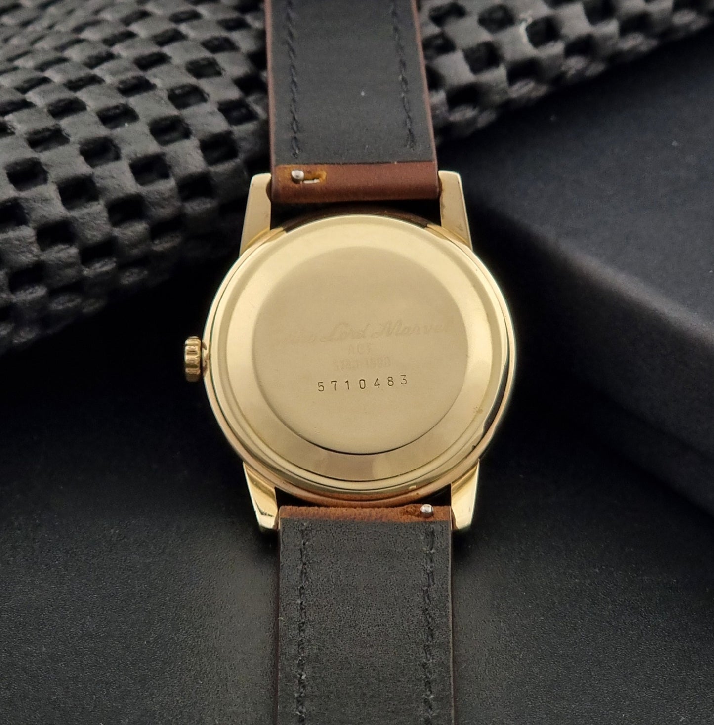Vintage Seiko Lord Marvel 5740-1991 gold filled watch on a dark background case back view