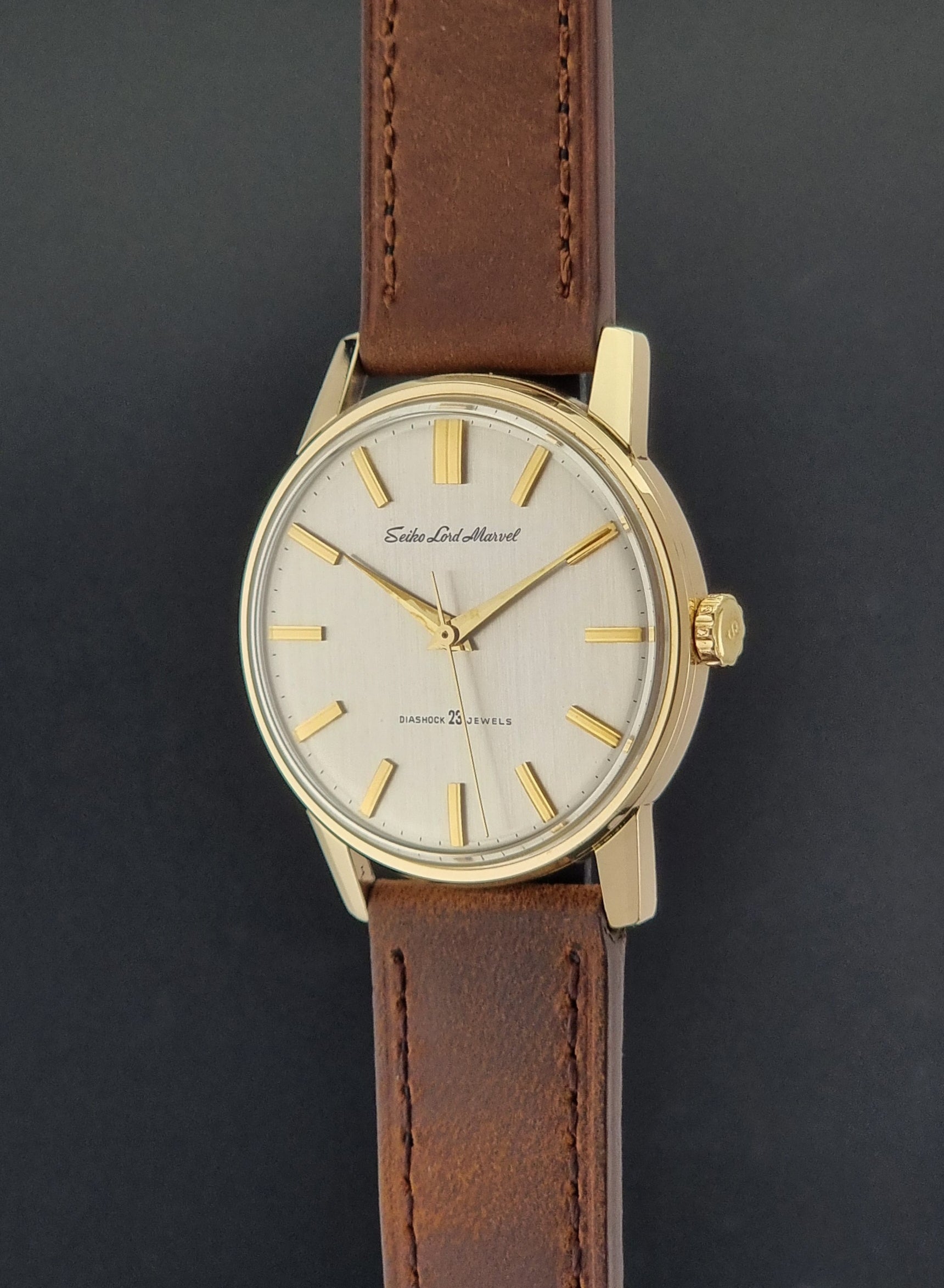Vintage Seiko Lord Marvel 5740-1991 gold filled watch on a dark background crown profile view